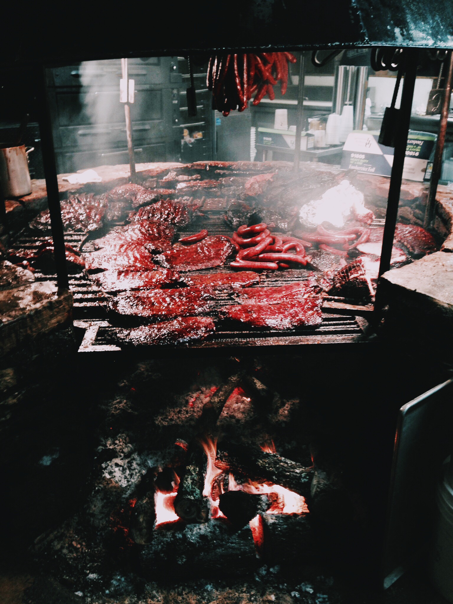   {giant fire pit with the most delicious bbq i've ever eaten. picture c/o kevin!}  