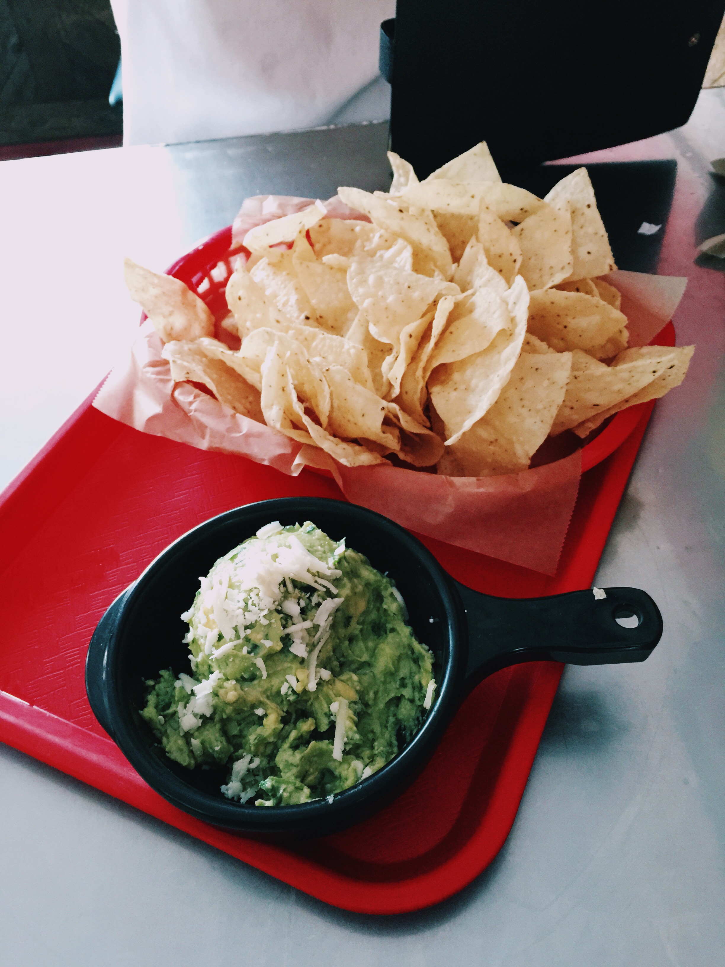   {chips and guacamole at torchy's tacos.}  