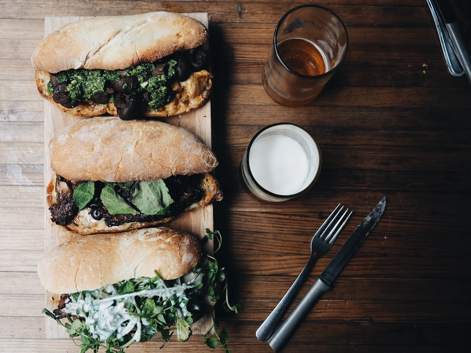 {Sandwiches & beers. Top to bottom: Summer Mushroom, Heirloom Pig, Short Rib.}