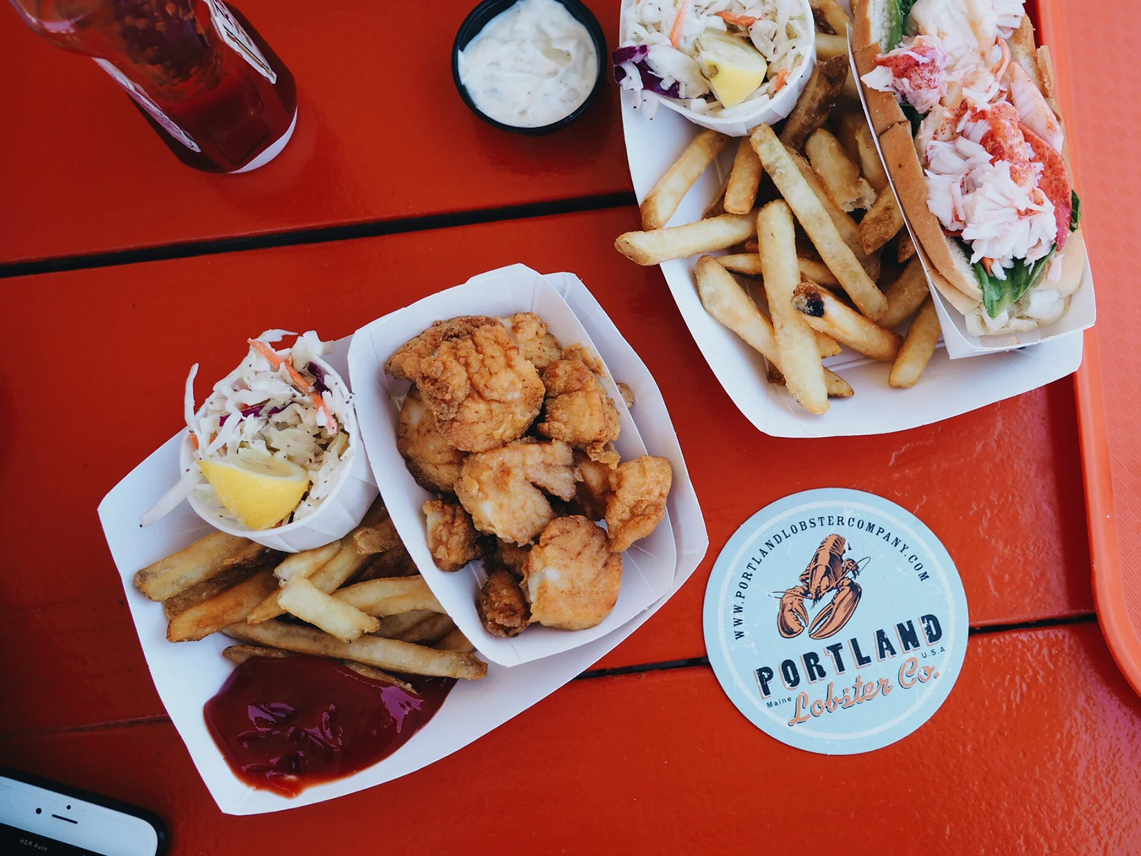 {Fried scallops, fries, and a lobster roll.}