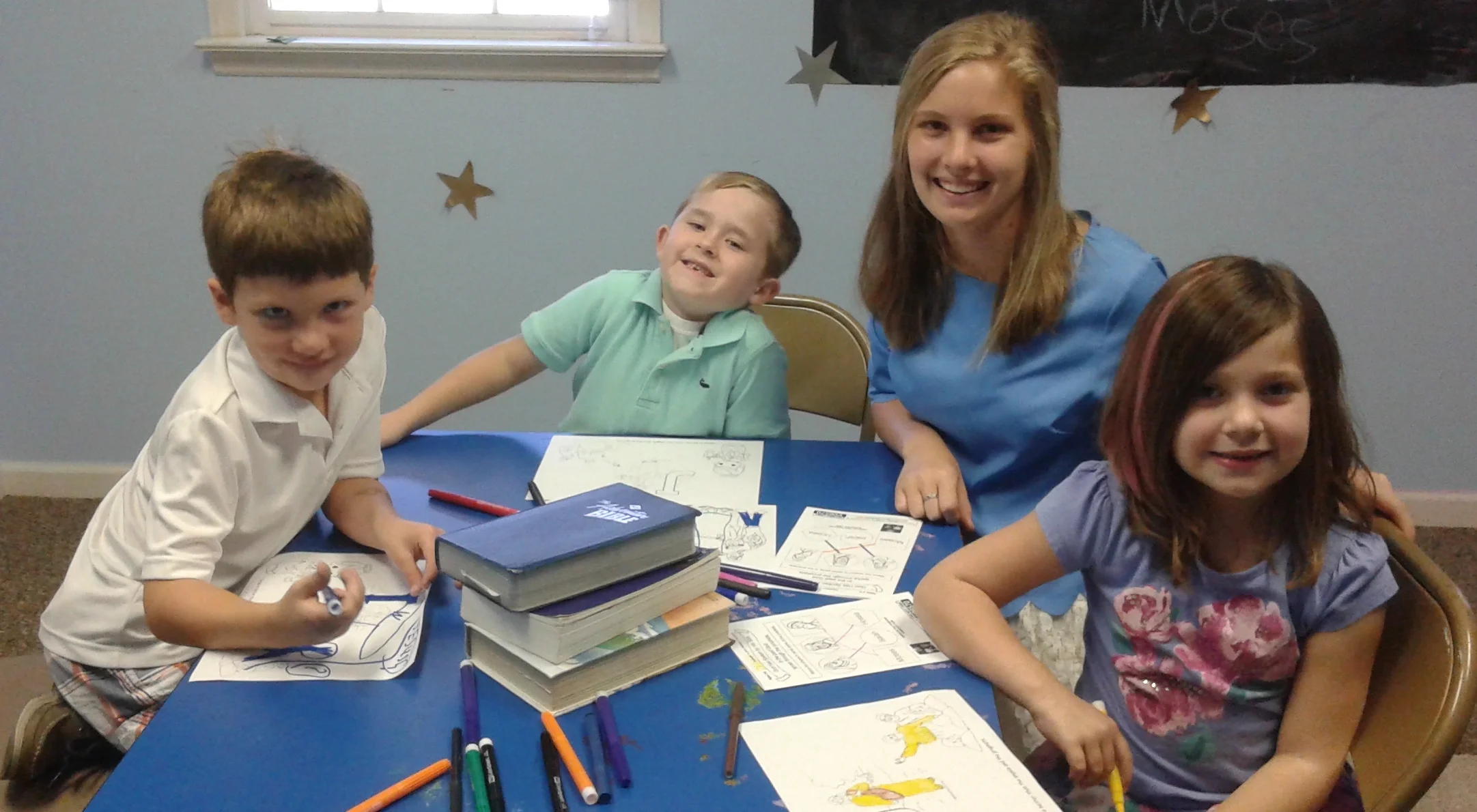 Margaret Davis helps the first graders.