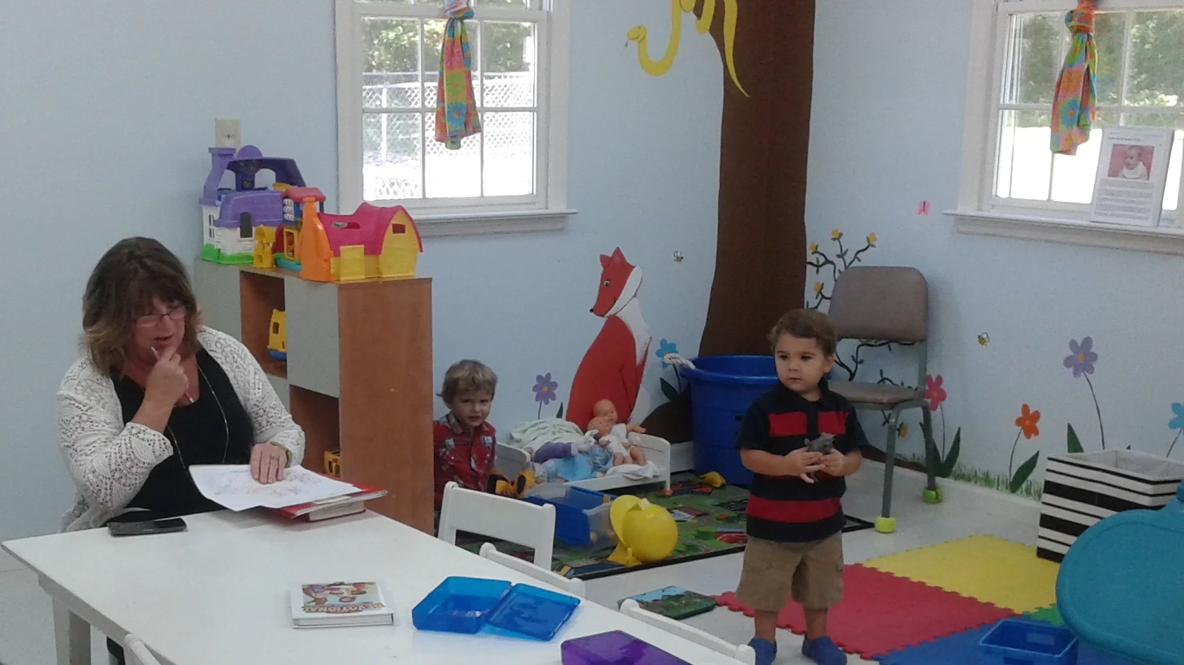 Ms. Paula busy in the nursery.