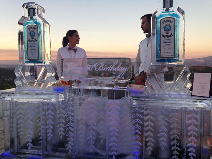 The custom ice sculpture bar using elements from the invitation was absolutely stunning.