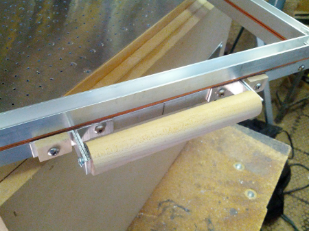 Spacers added to the frame near the handles.
