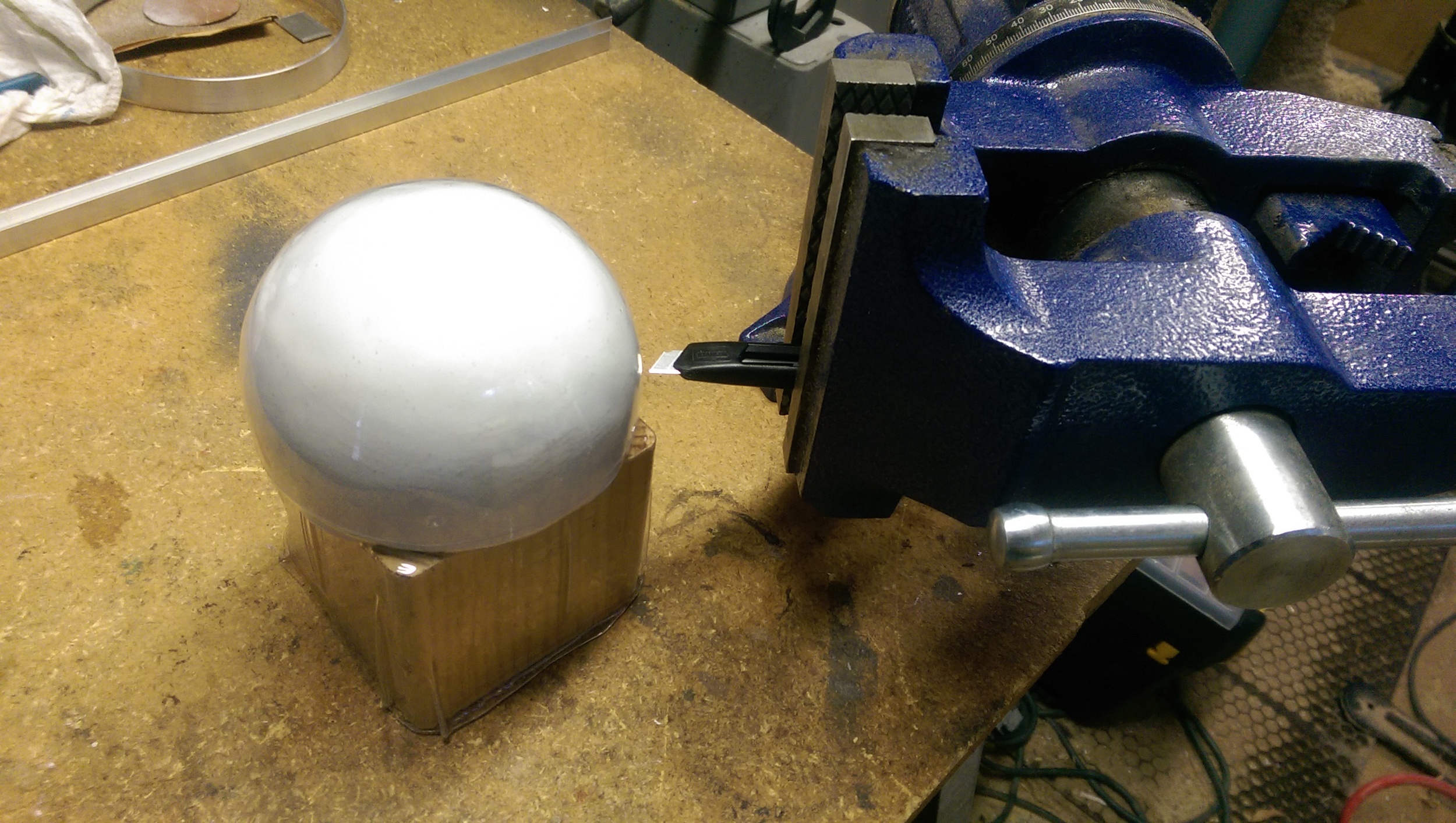 Using a surface gauge to score the plastic