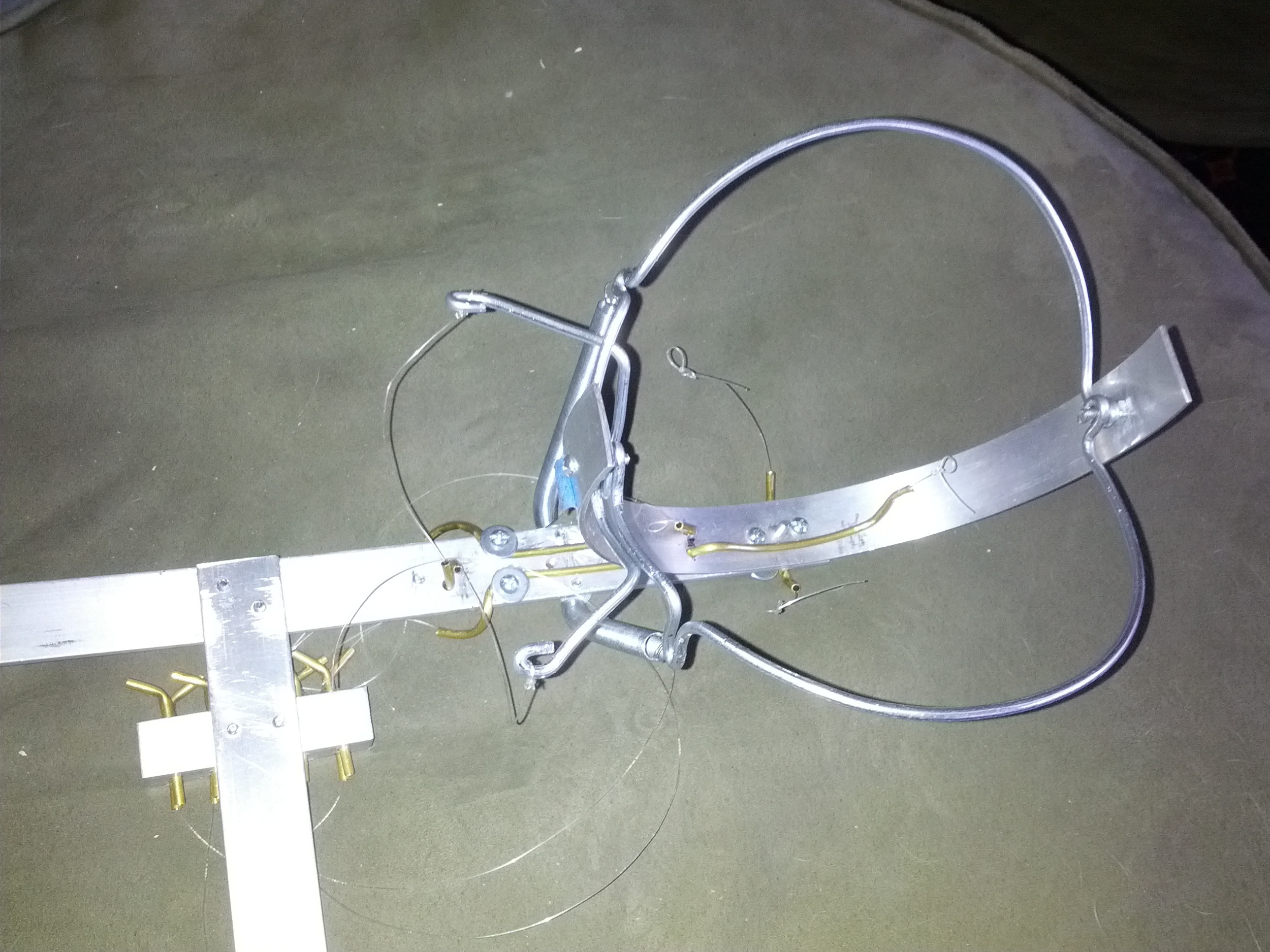 With the eyeball and outer structure removed, the blink mechanism and brass tubing guides are visible