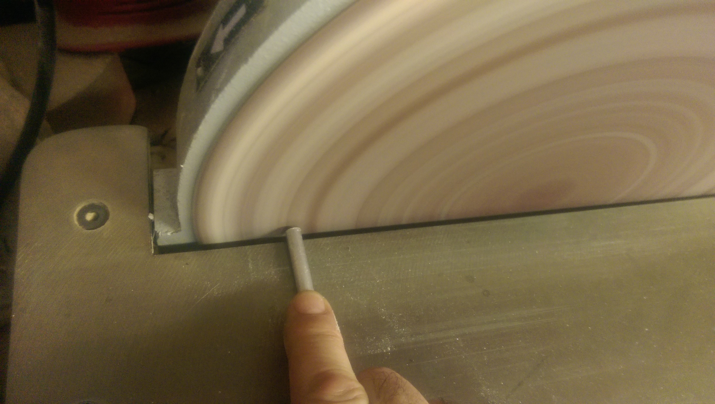 Sanding down the ends to clean up the rough cut