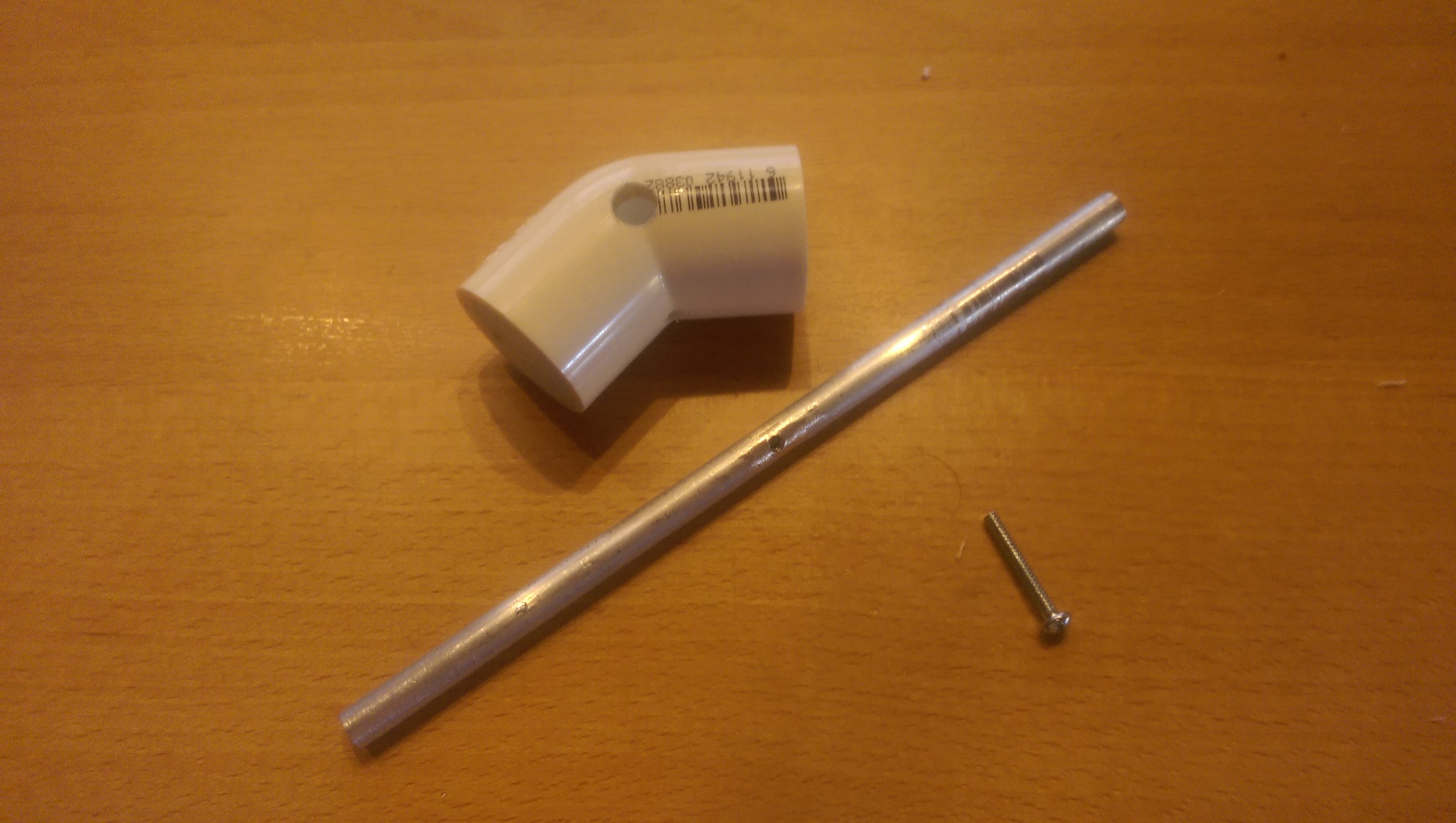 Clearance hole drilled in the 45 degree PVC connector joint and another clearance hole for the lock down bolt