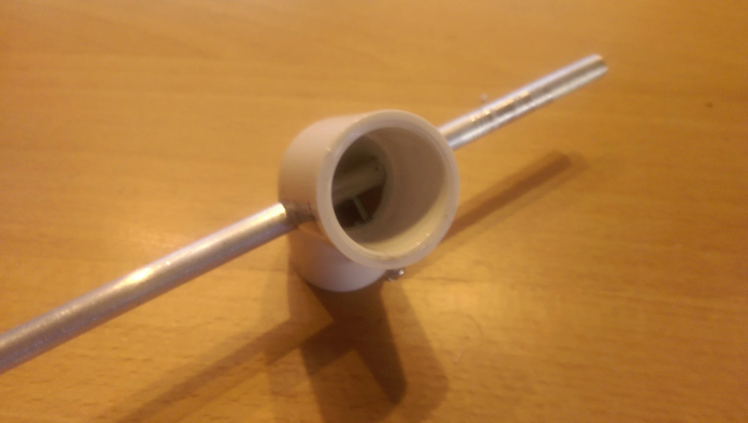 Lock down bolt screws into the threaded rod locking it on the PVC joint