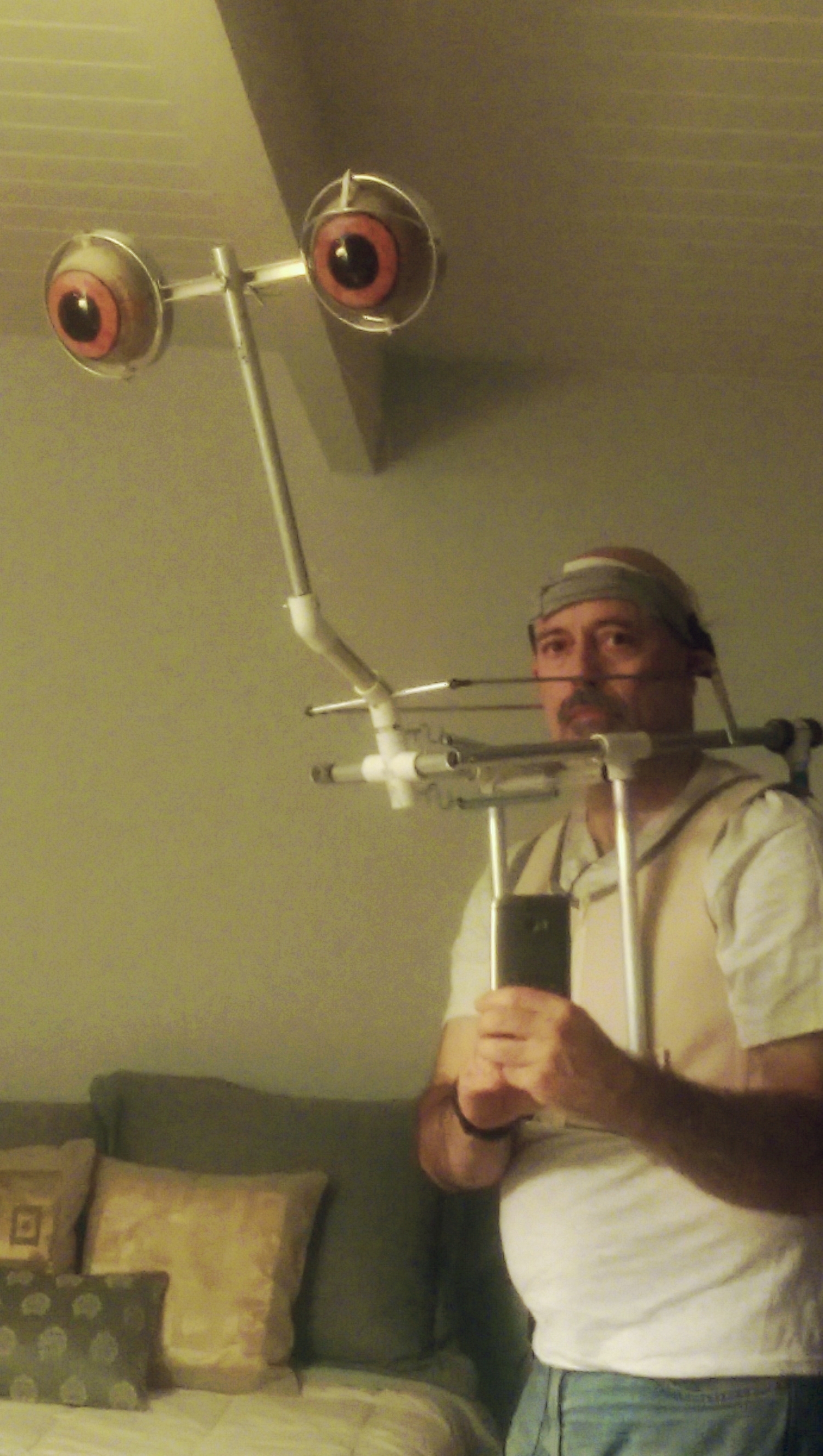 The mechanical structure is mounted in the FX corset. The headband is firmly wrapped around my head for controlling the neck/head mechanism.