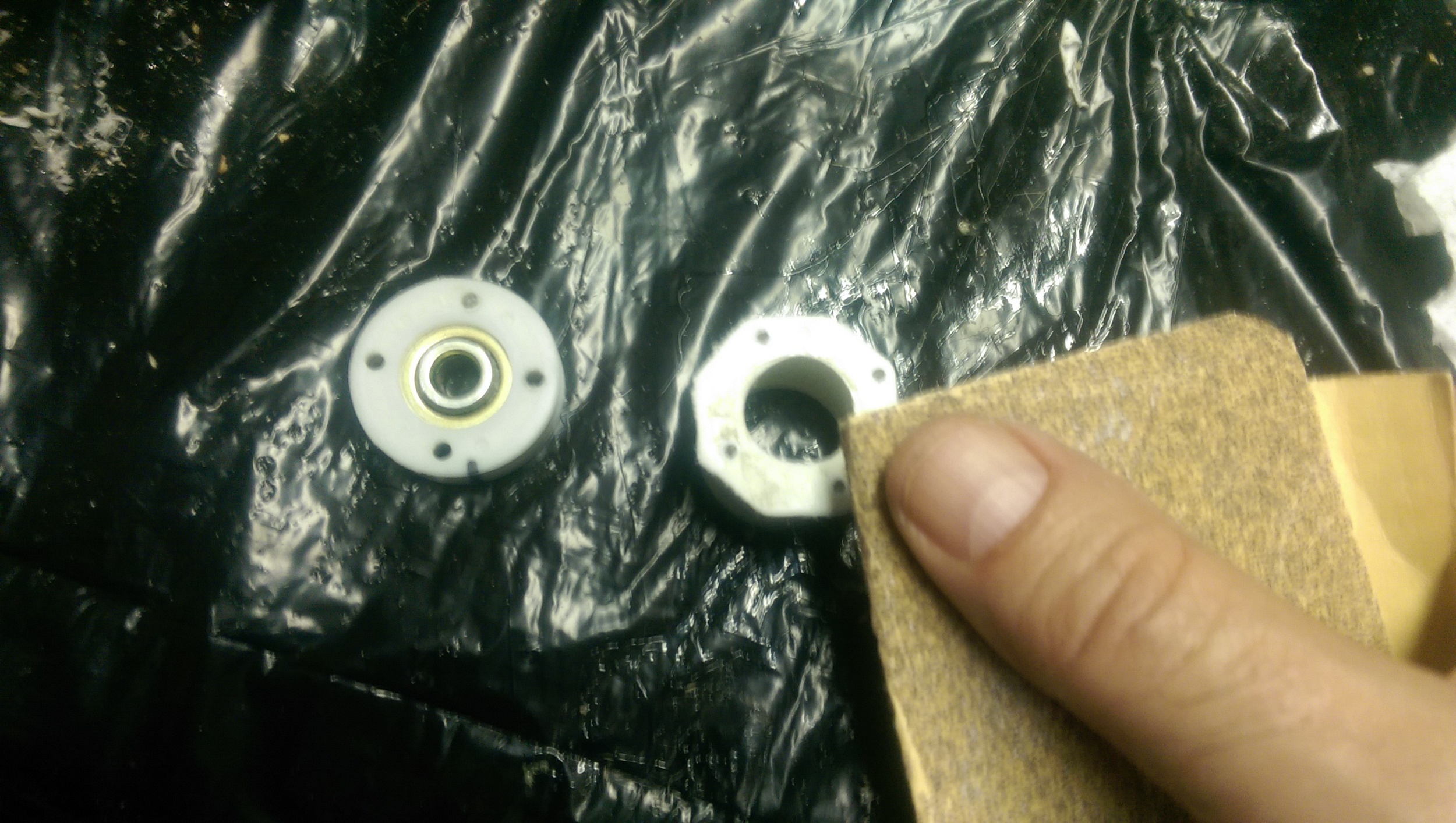 End cap gets pilot holes and a large clearance hole for the inner ring. Rough the surface for epoxy