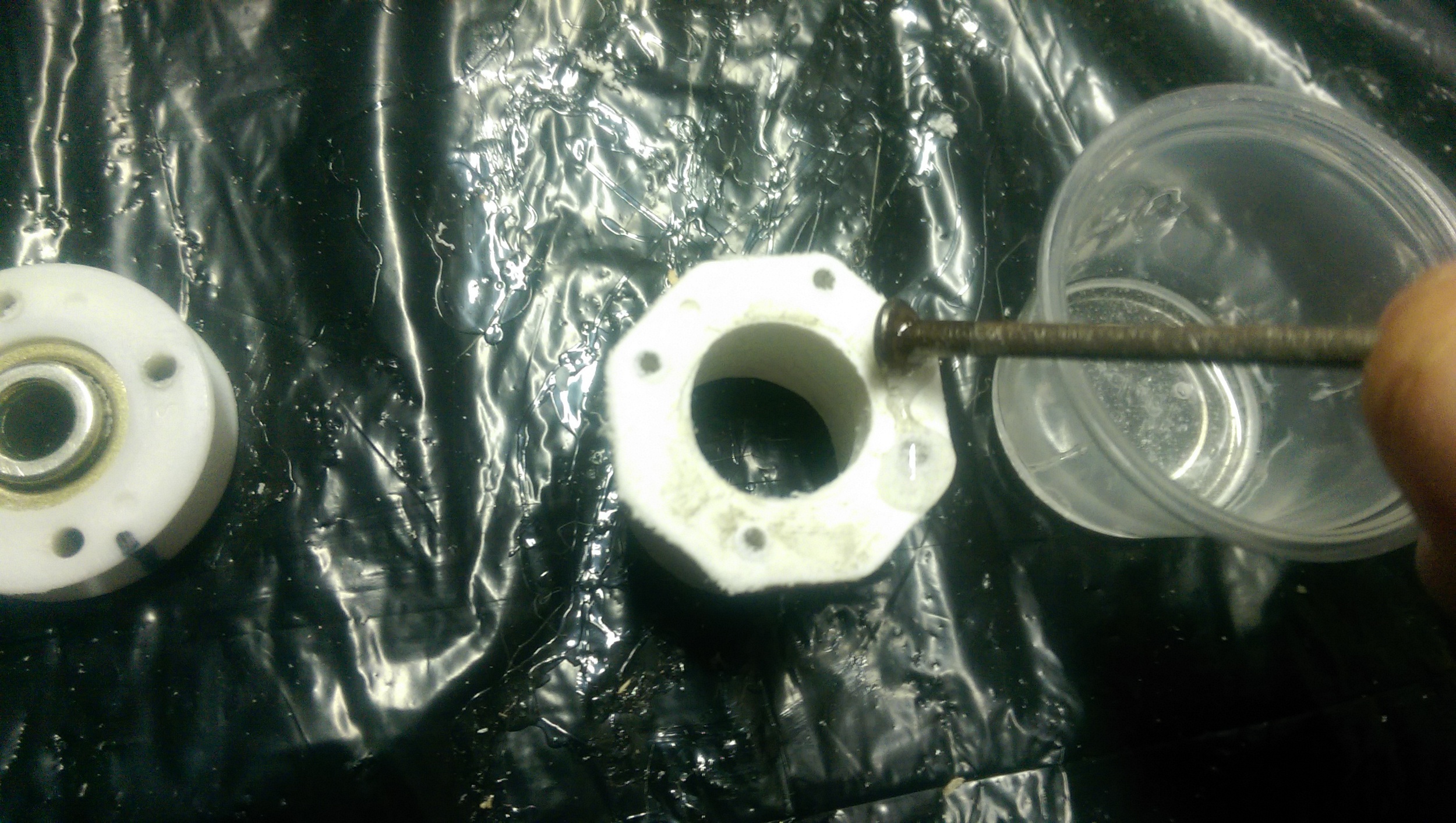 Apply epoxy just to the edges, not the bearing