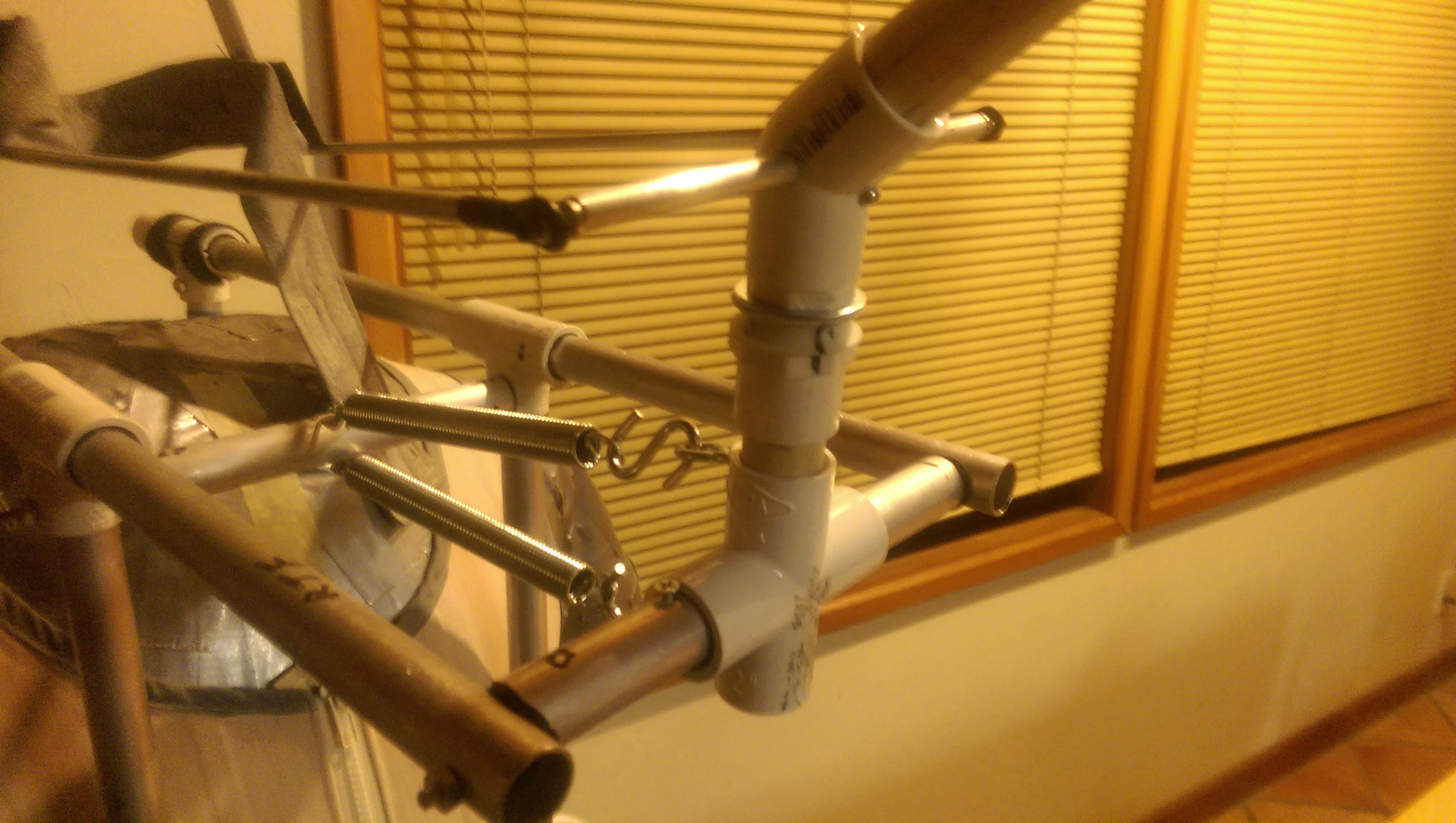 A short section of PVC connects the new azimuth joint (left /right rotation) to the elevation joint made by the PVC x joint (up/down rotation).