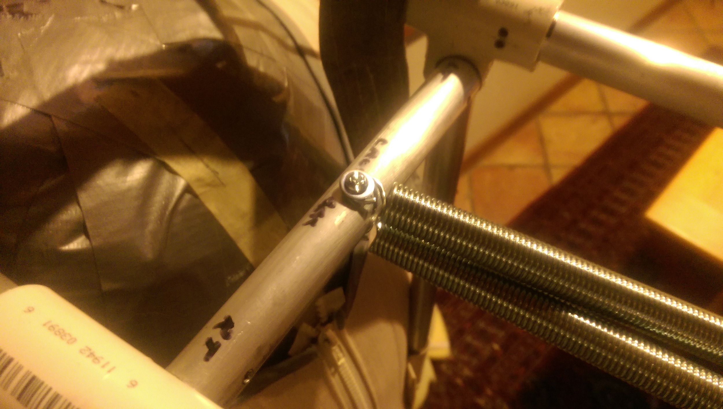 Washer added to the bolt and the loop on the spring crushed down smaller