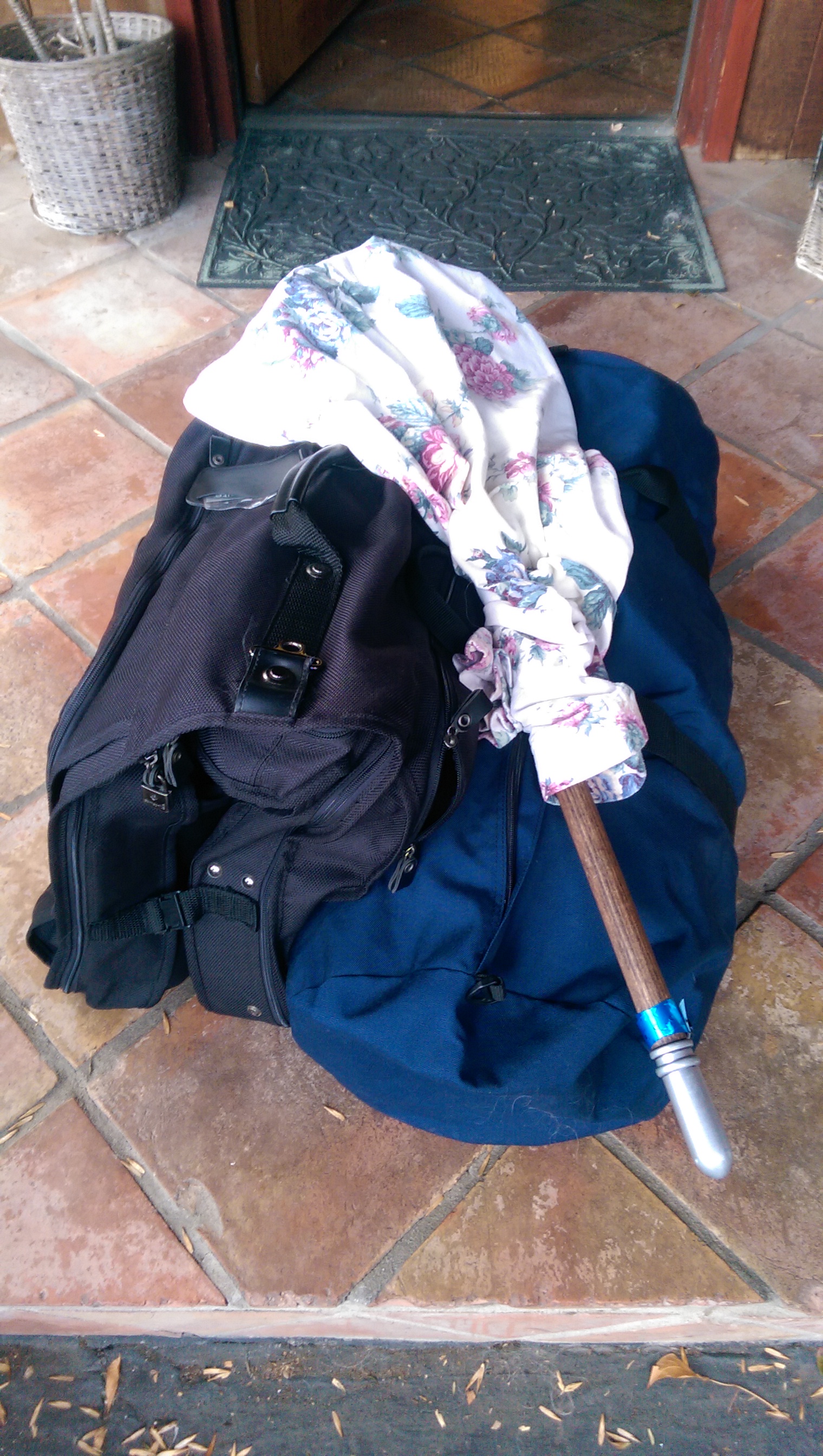 Headless Horseman divided between a garment bag and a smaller duffel bag