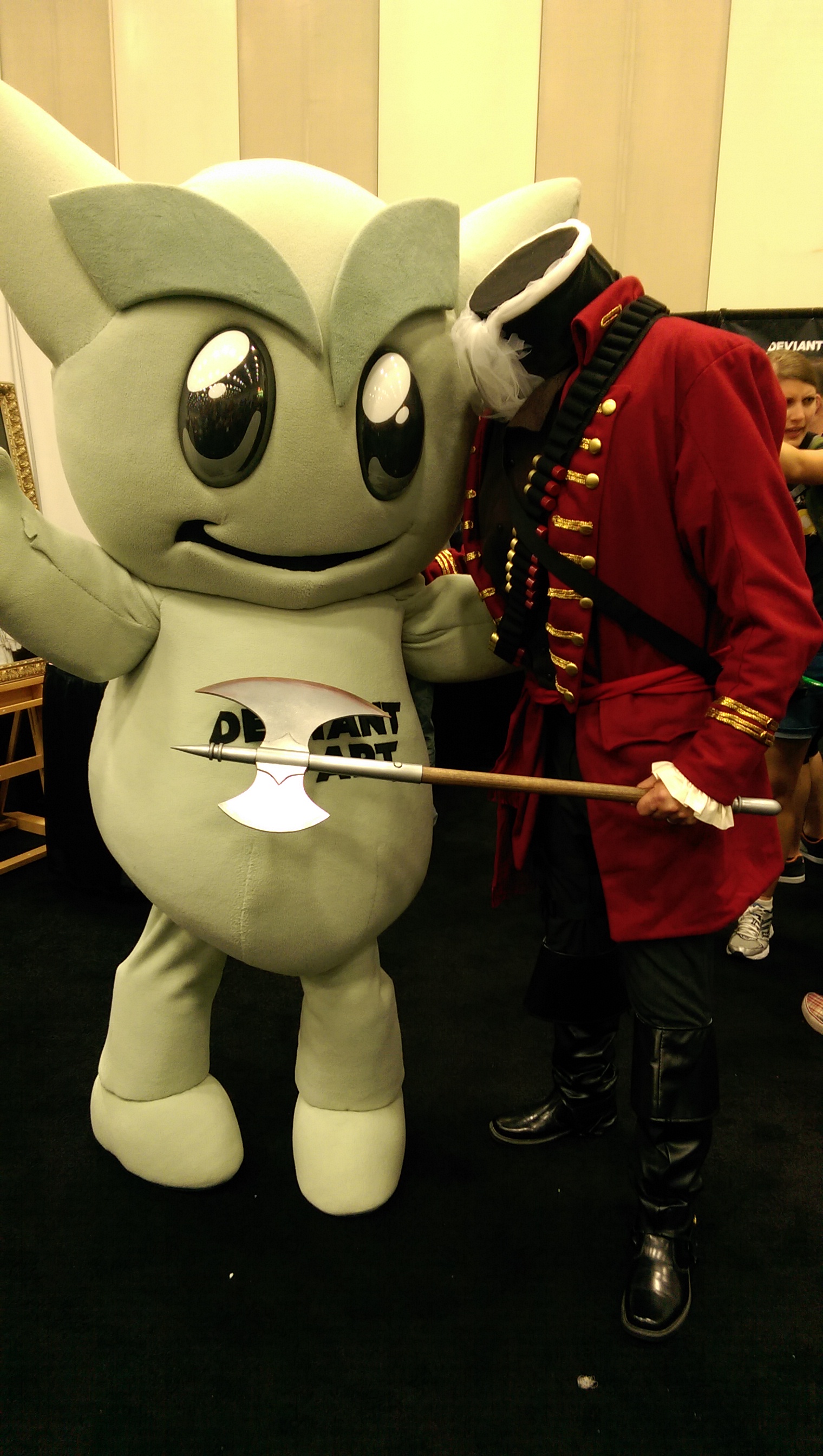 The Deviant Art folks (who sponsor Artists' Alley), were excited to have me chop off the head of their mascot.