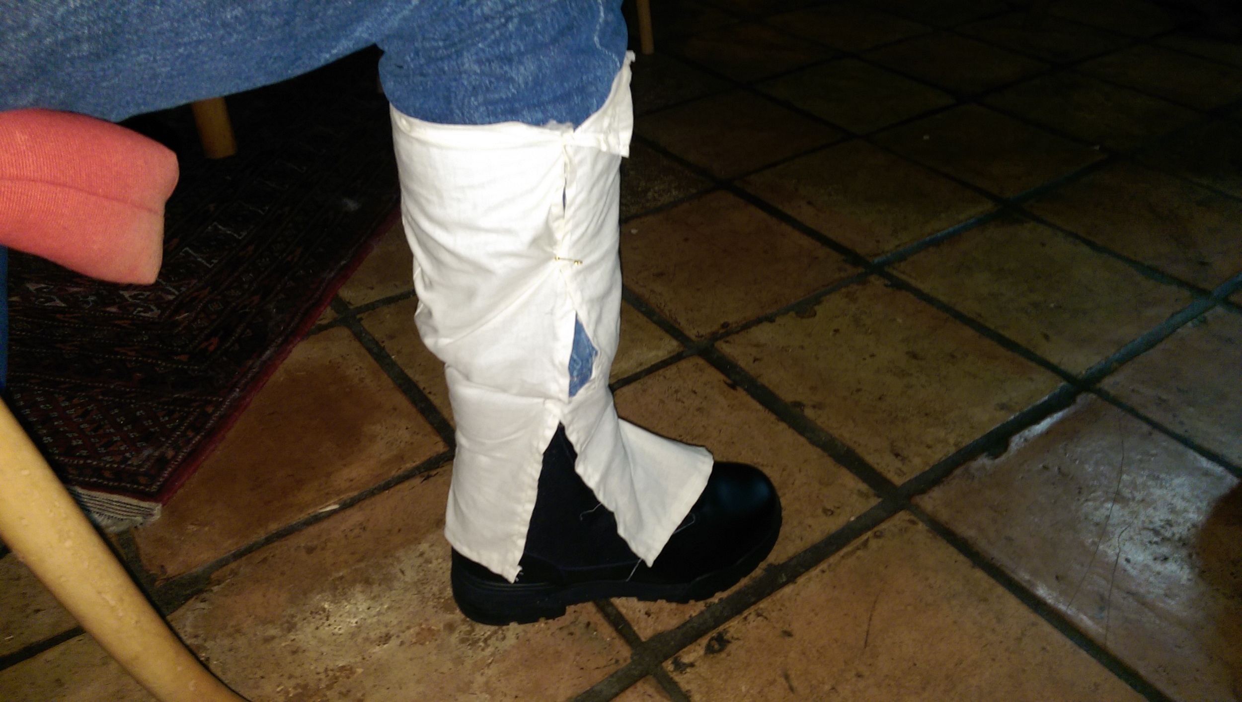 Test fitting the gaiters over my pants leg and the boot, indicating adjustments that needed to be made