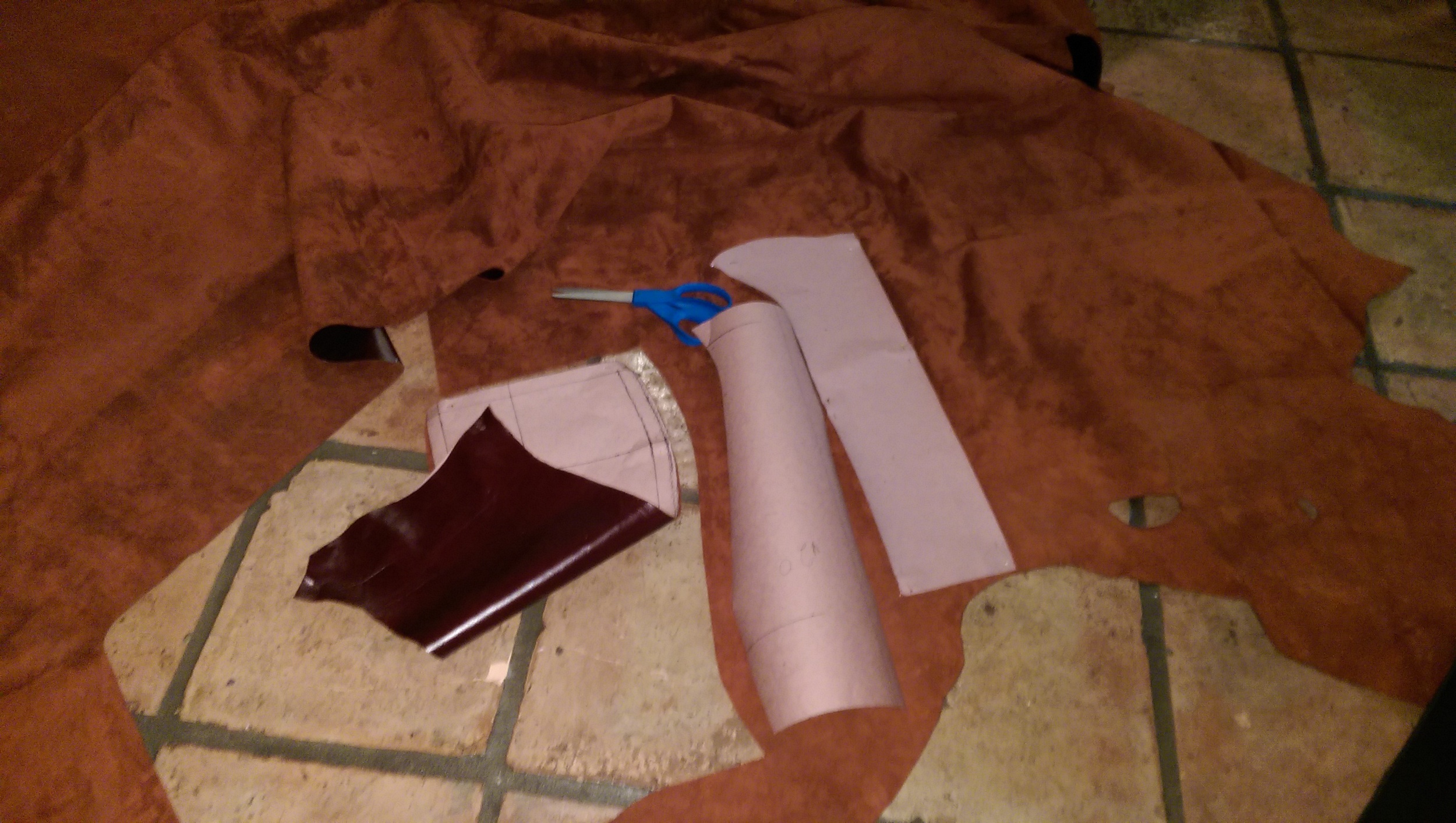 Cutting out the suede pieces from the new pattern