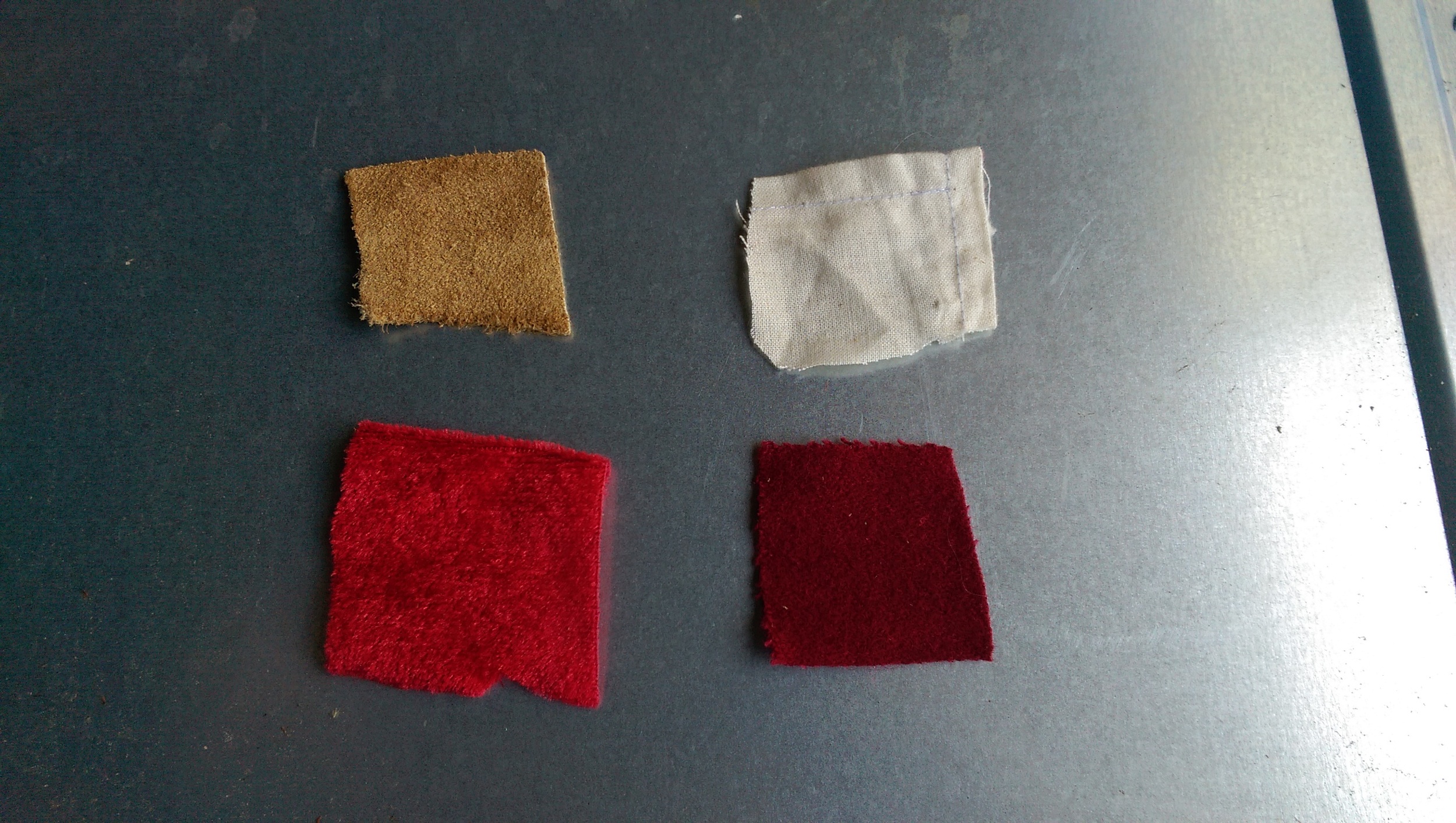 From upper left clockwise: leather, cotton linen, wool, red velvet