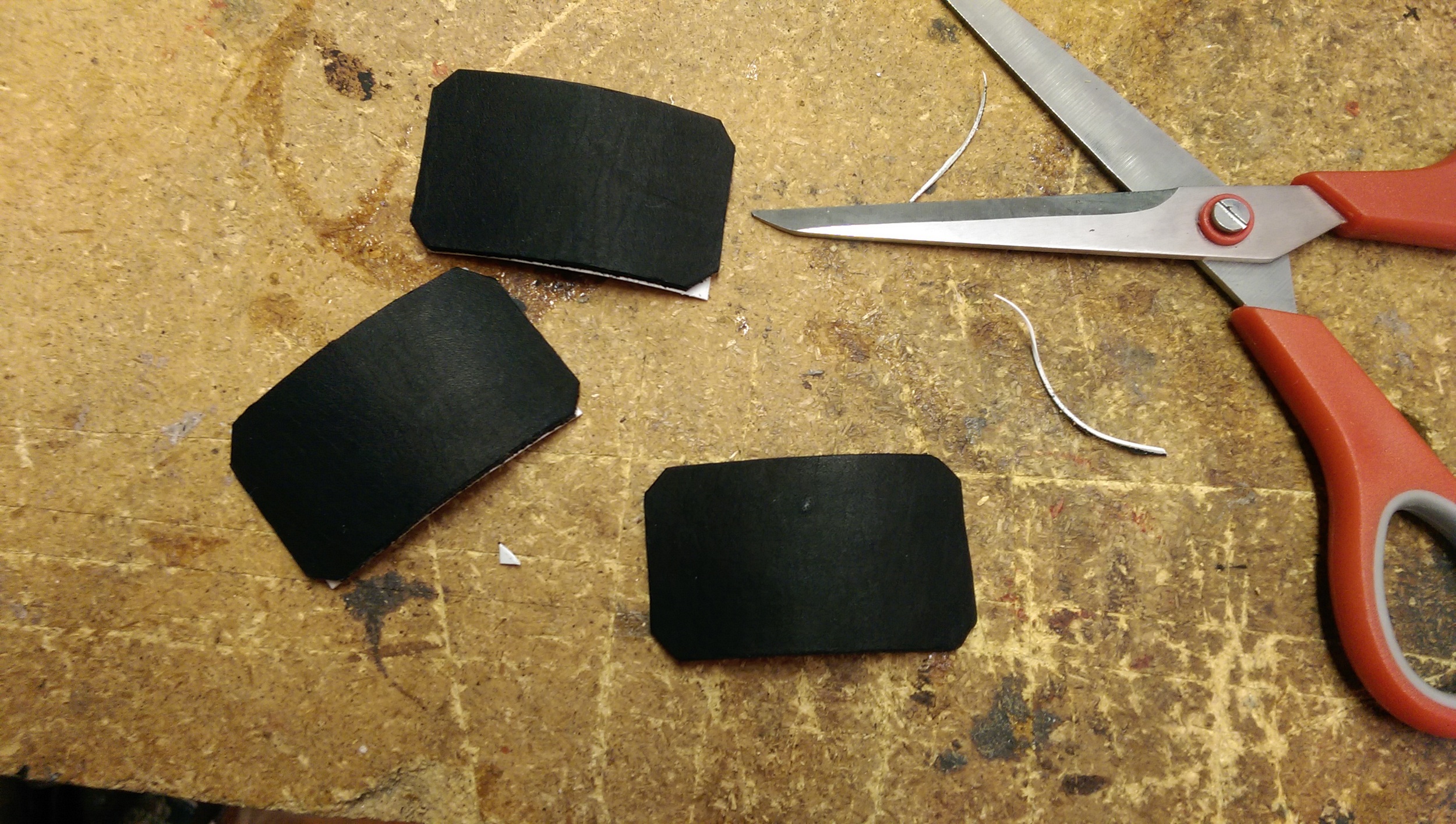 Corners of the laminated shield are cut off