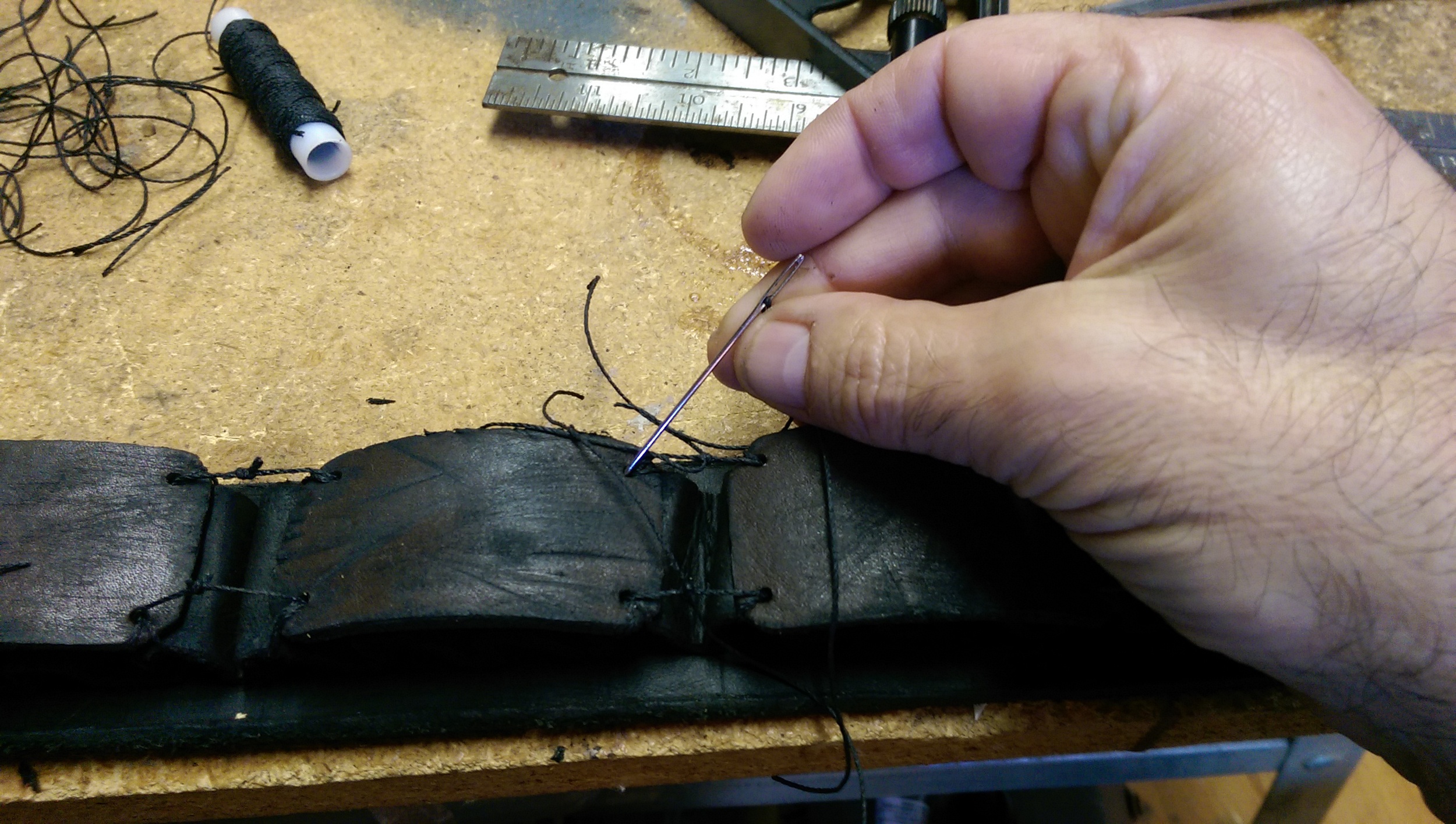 Tying the shields down to the bandoleer pockets.