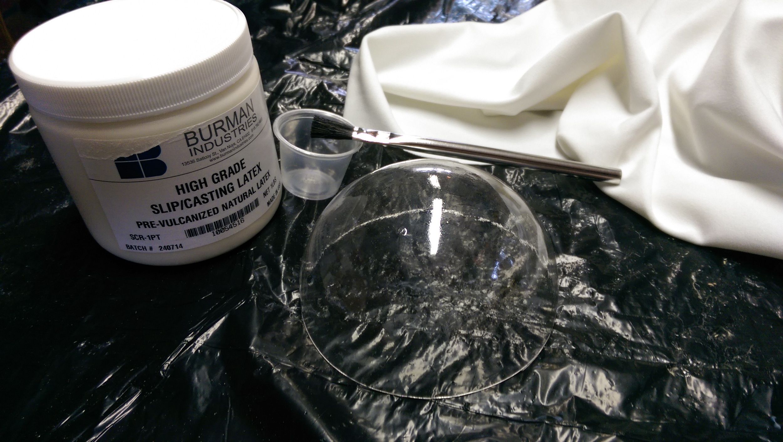 The silicone, spandex fabric, and an extra eye dome used as a mold