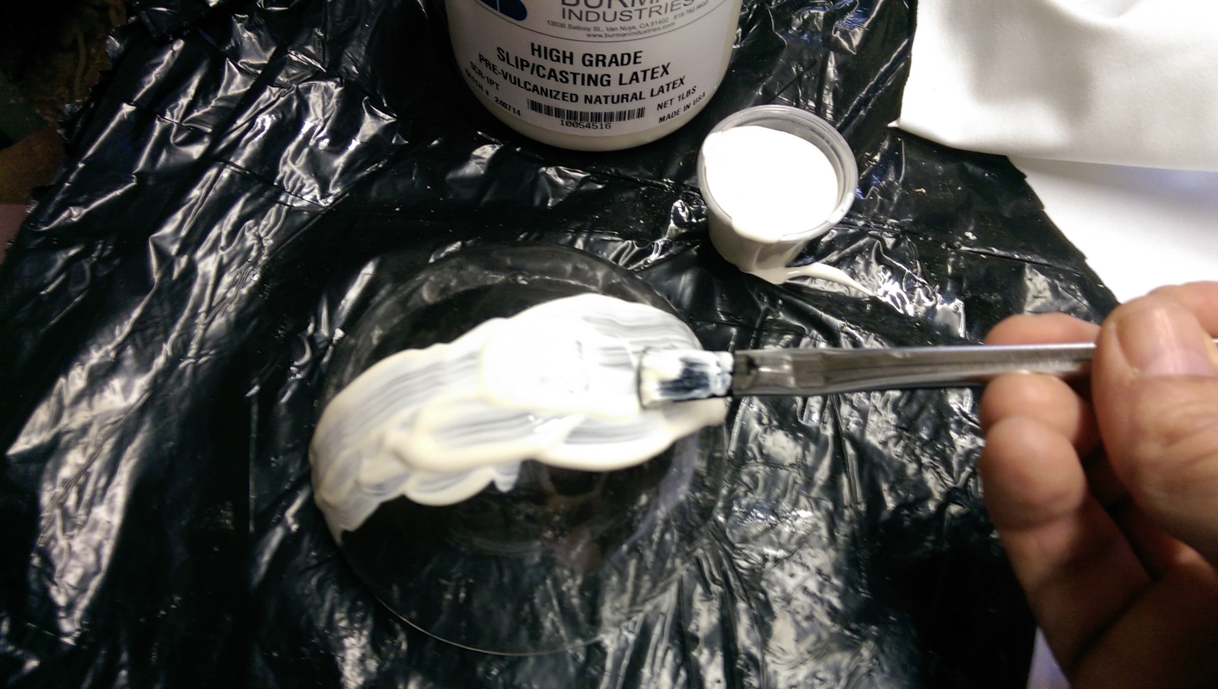A layer of silicone is spread over the dome