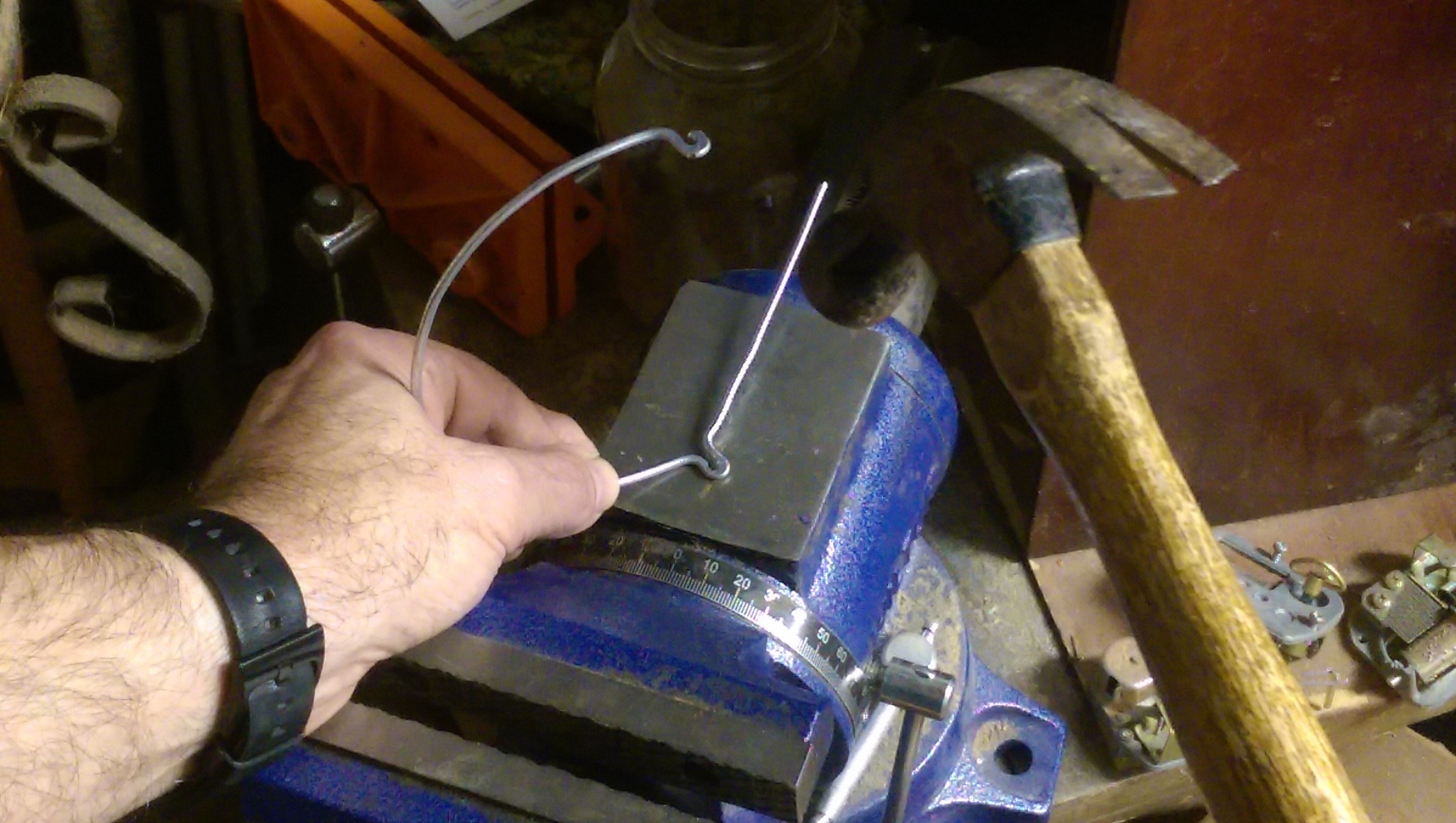 The final shape is much simpler and by hammering flat the pivot curve, the interference between the upper and lower eyelid is reduced along with a lower profile at the pivot.