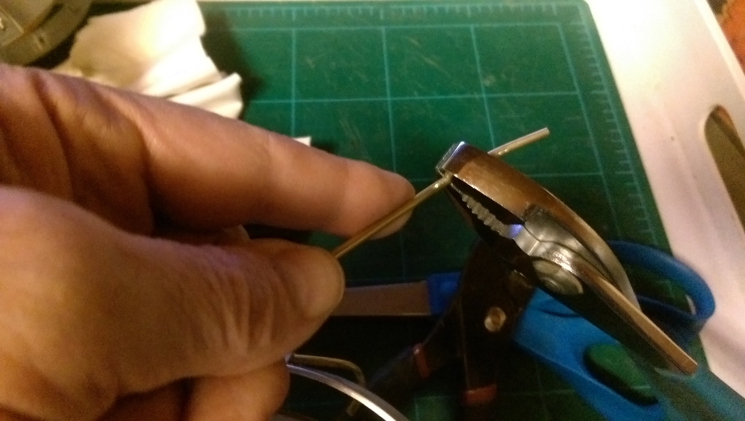 I use pliers to bend the tubing