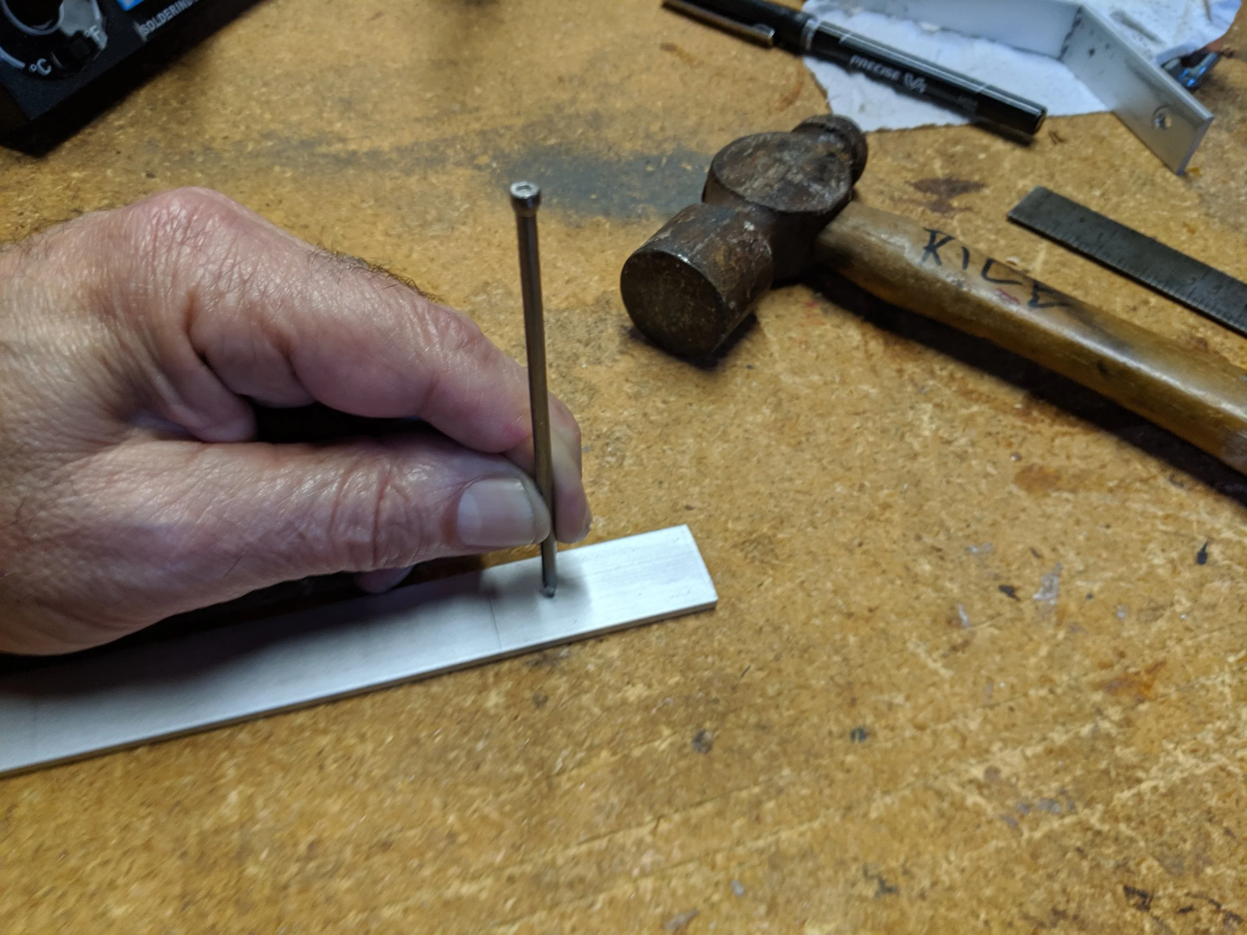 I use a nail as a center punch