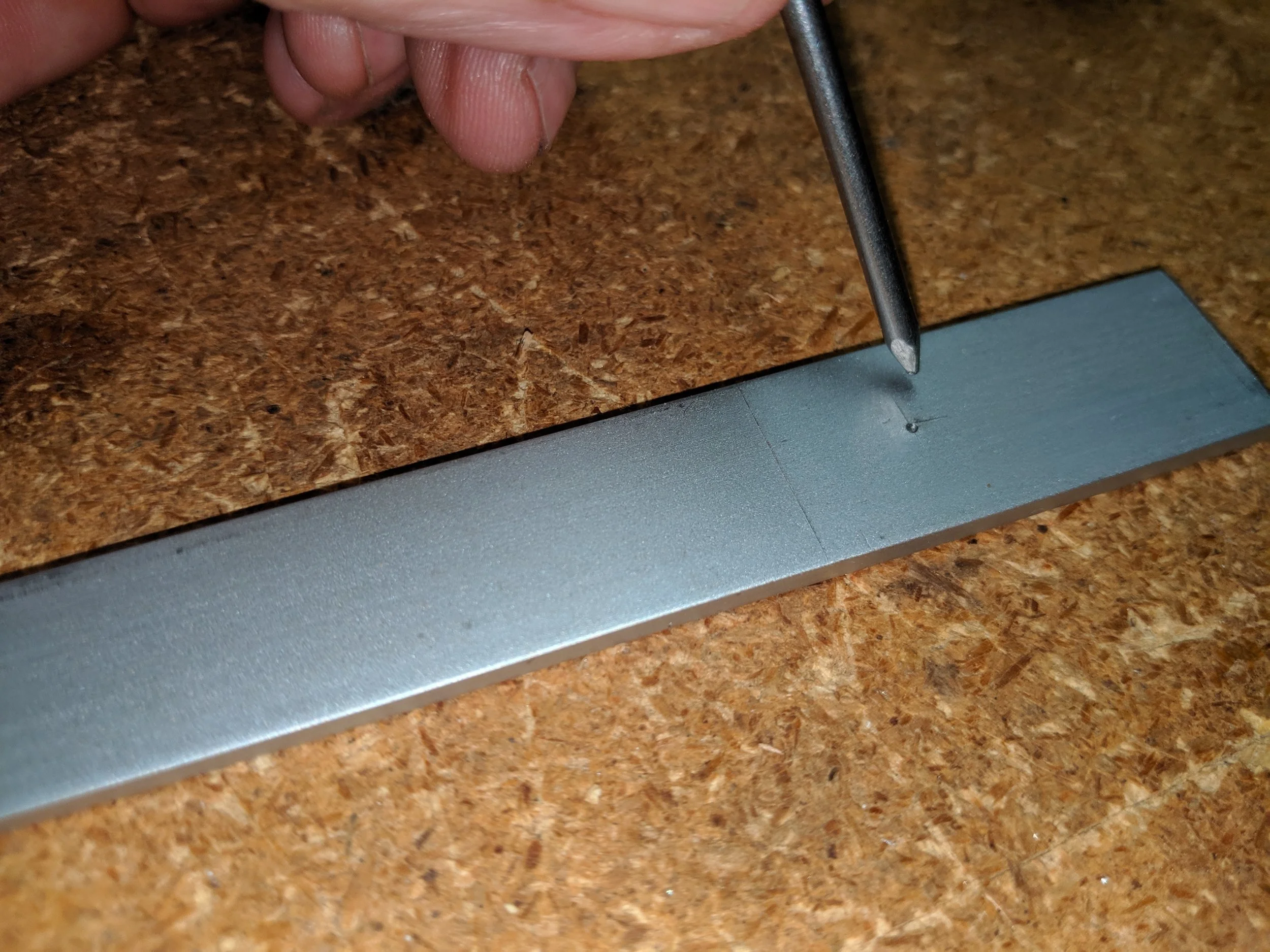 Creating a divot to accurately guide the drill