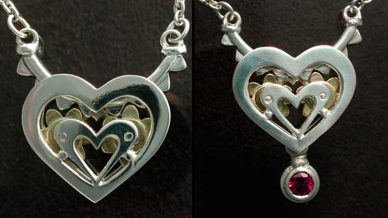 Sterling silver hearts and ratchets with 18 karat gold gears.