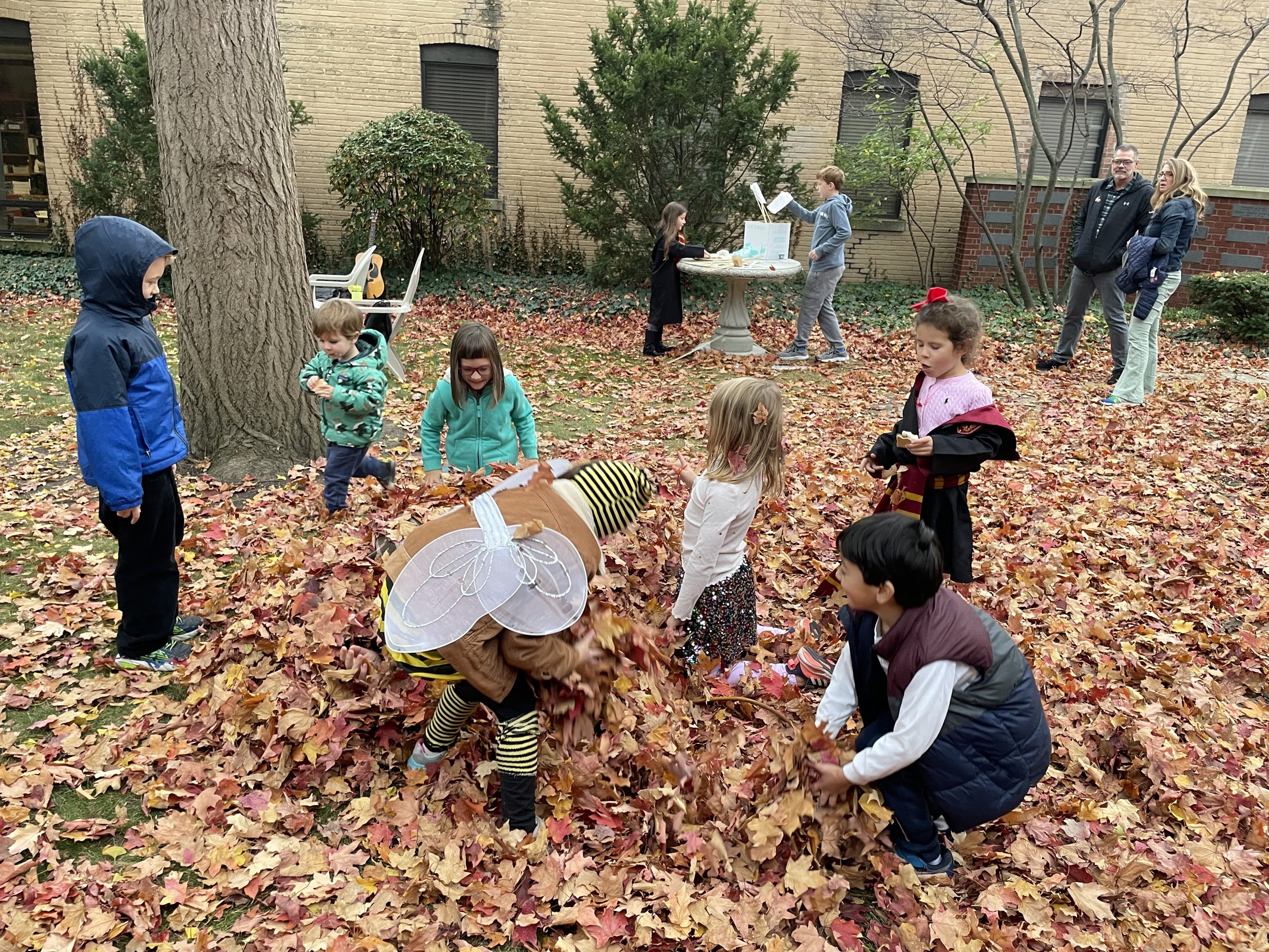 Kids playing in leaves copy.jpeg