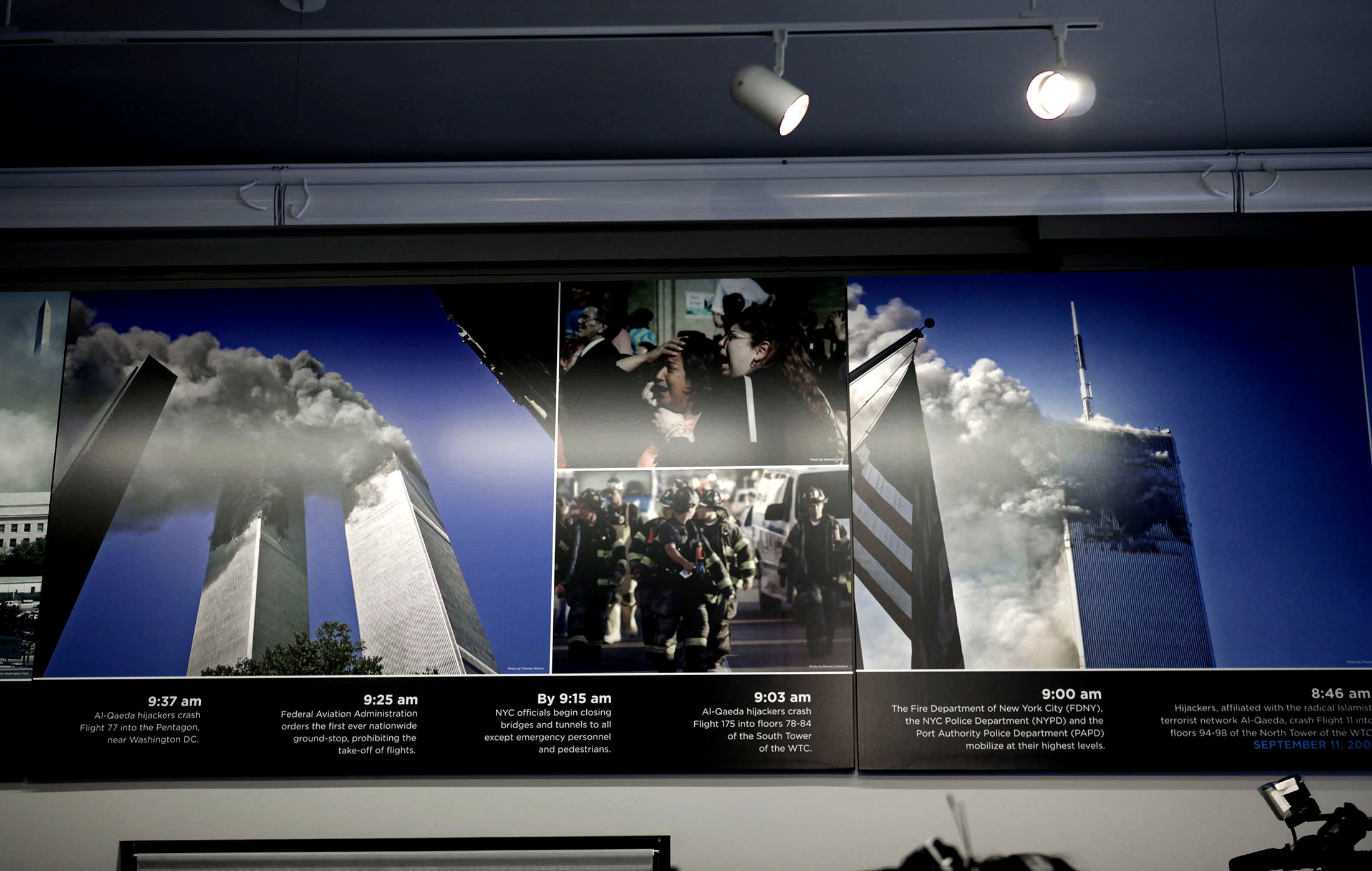 Permanent since September 2009: Three of Thomas' pictures from the terrorattacks on display at the 9/11 Memorial Preview Site in New York. Two of them showing in this photo (the two large ones).