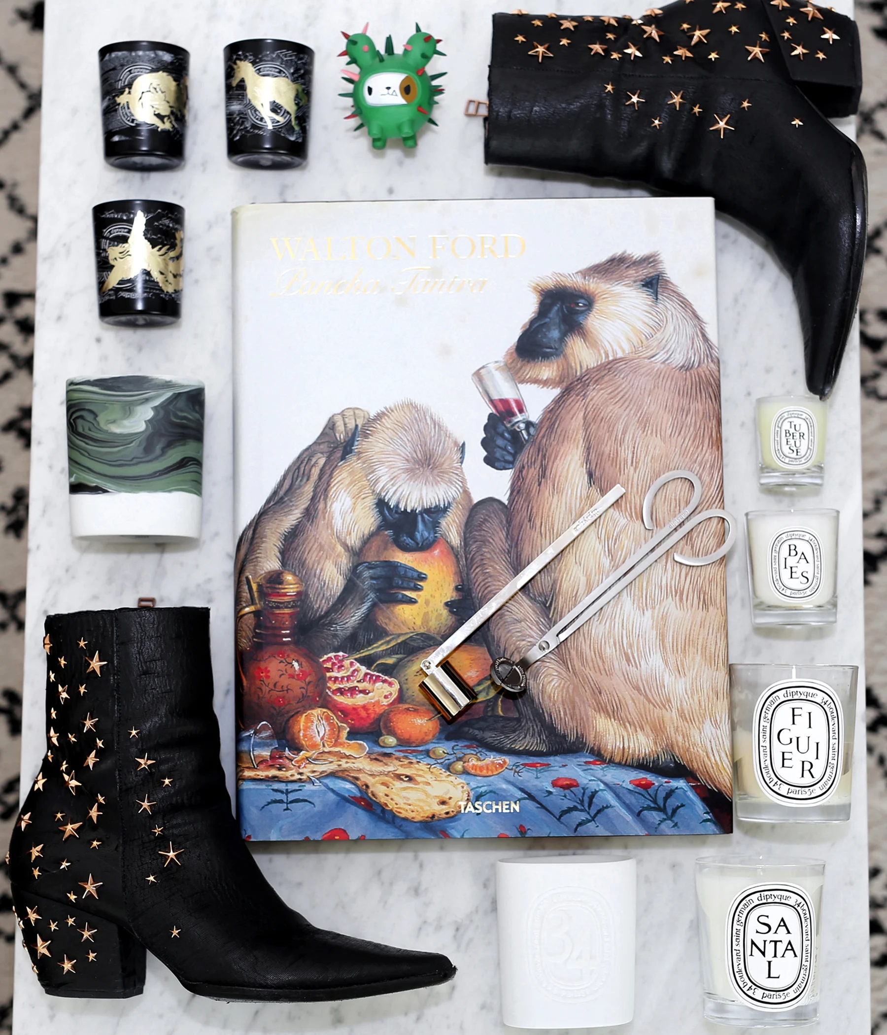 Matisse boots from their collaboration with actress Kate Bosworth. These are called the Charlotte boots. They're half a size too big but I only discovered them when they went on sale and had practically sold out. Better half a size too big than too small. All candles featured here are from Diptyque. The book is Walton Ford's Pancha Tantra, one of my favourites. 