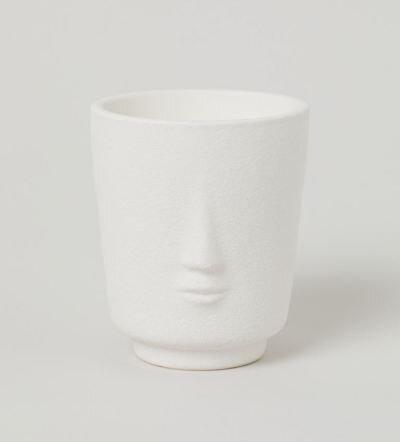 scented candle holder with face.jpg