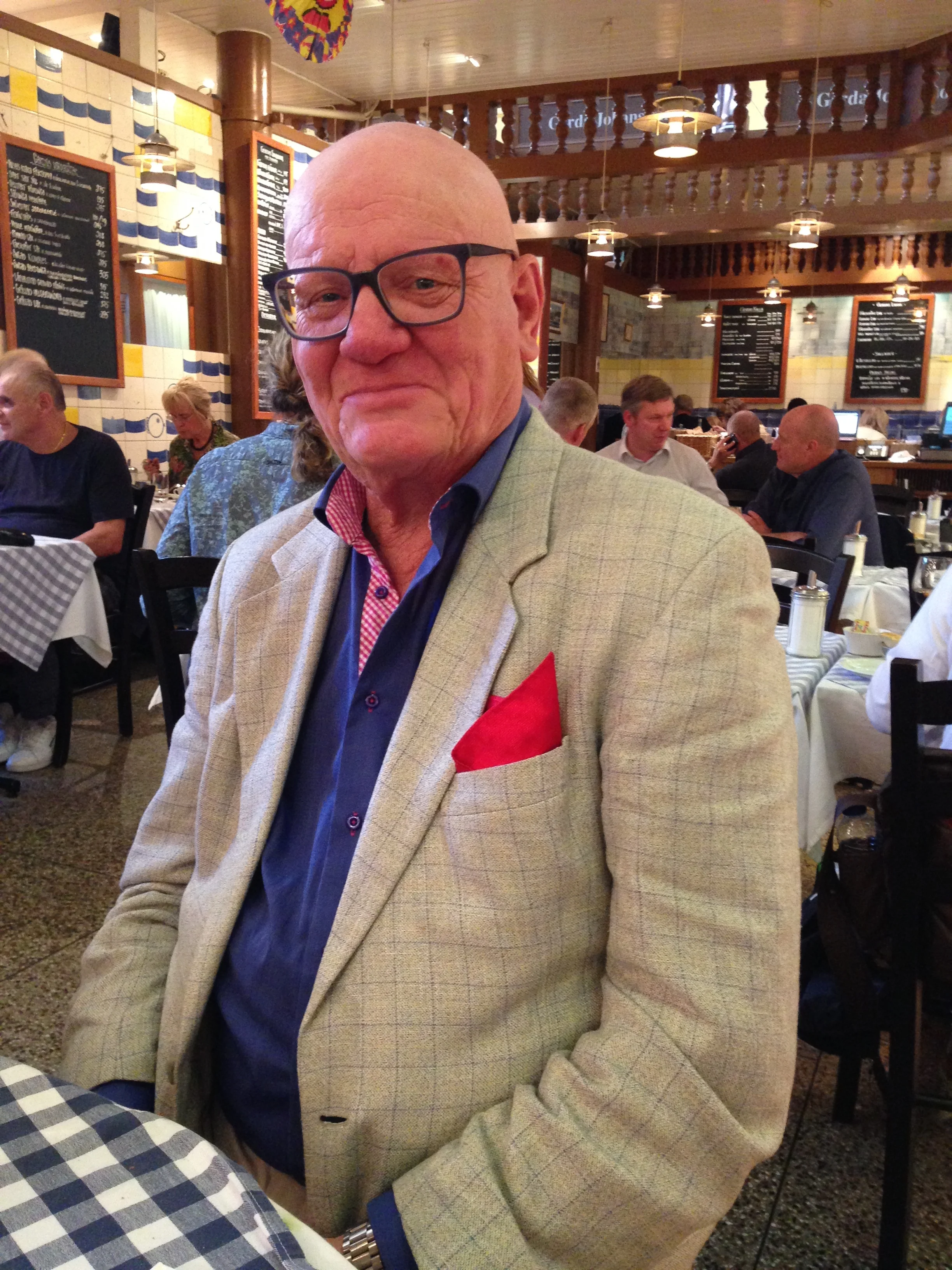 Elegantly dressed gentleman whom we had the pleasure of sharing a table with at the Östermalms Saluhall (local Food Market).