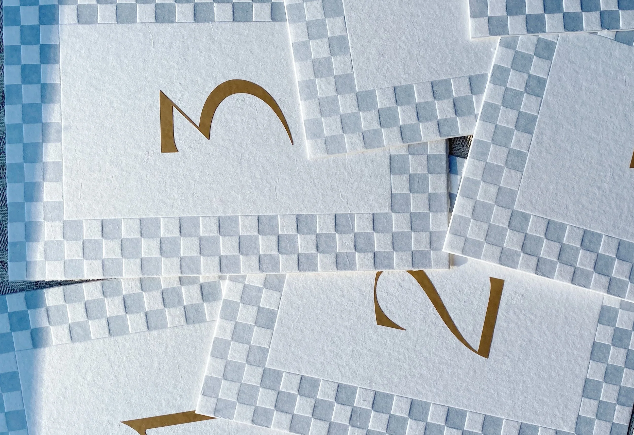 blue+and+white+checkered+letterpress+border+table+number+with+deco+inspired+numerals.jpg