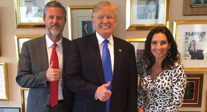 Jerry Falwell, Jr. with Trump.....right next to framed Playboy issue featuring Donald himself...