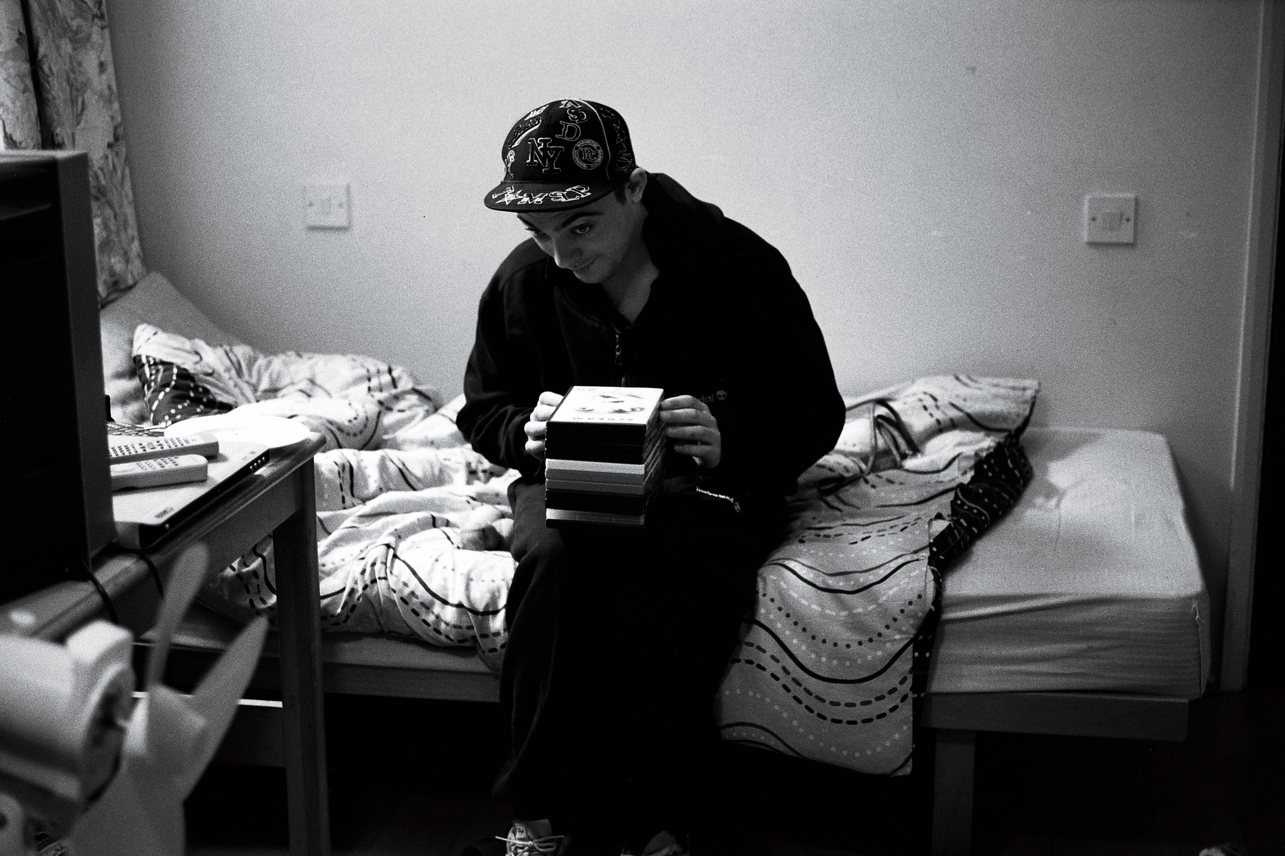 NORMAN_DVD'S ON BED.jpg