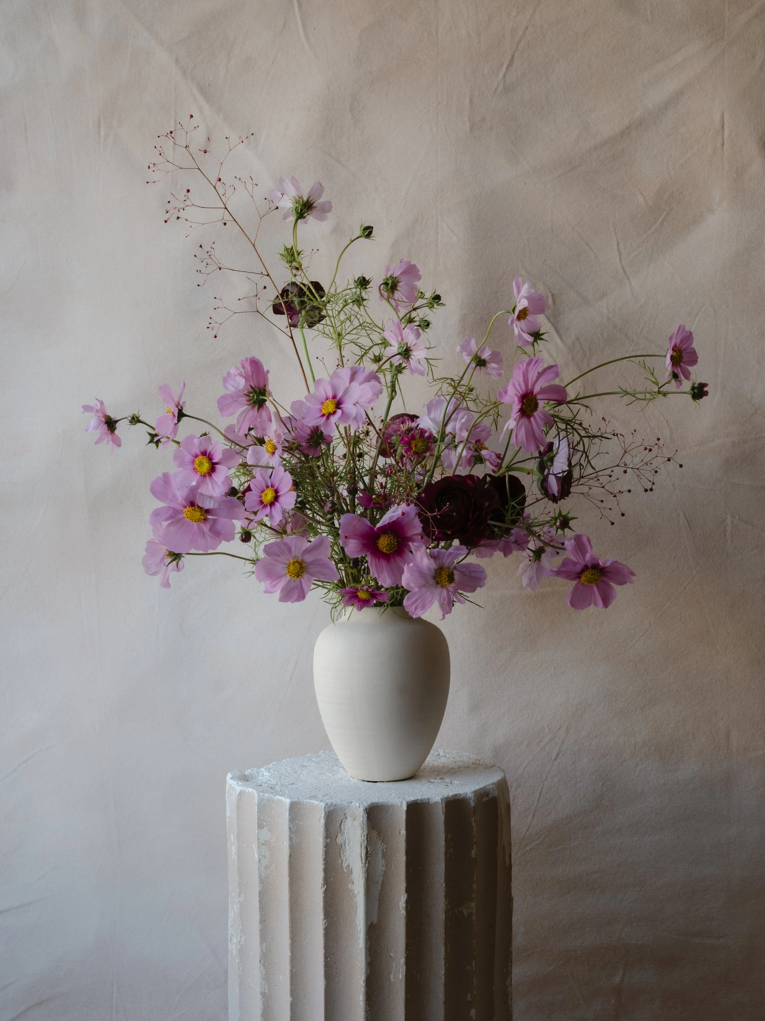 whimsical arrangement in ceramic vase .jpg