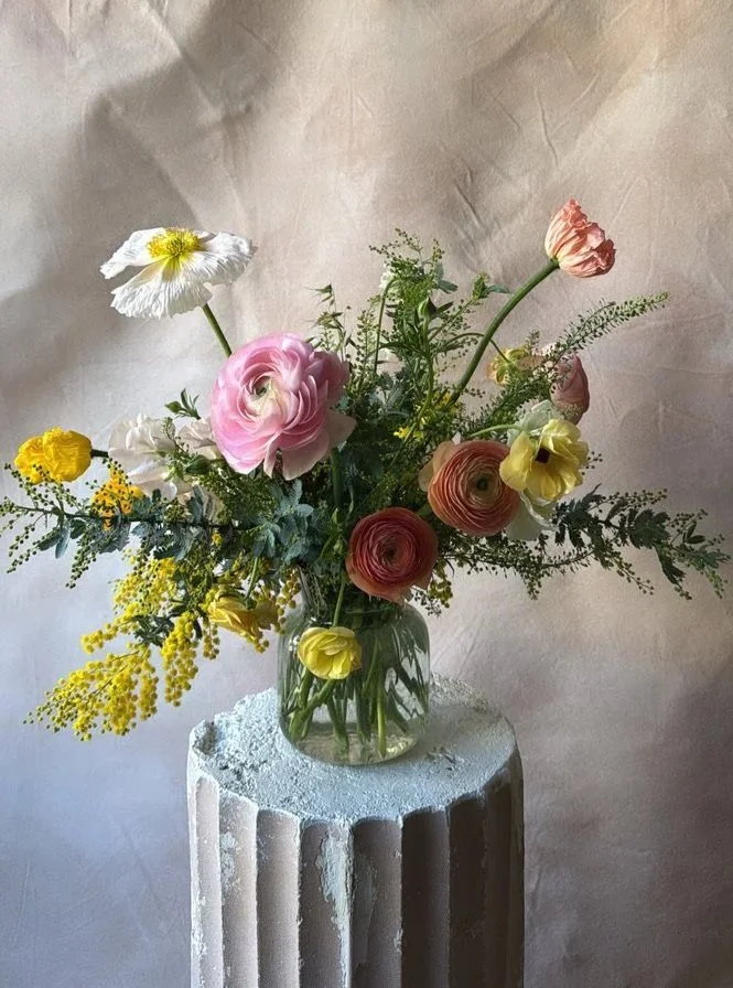 a valentine centerpiece arrangement in a bright color palette