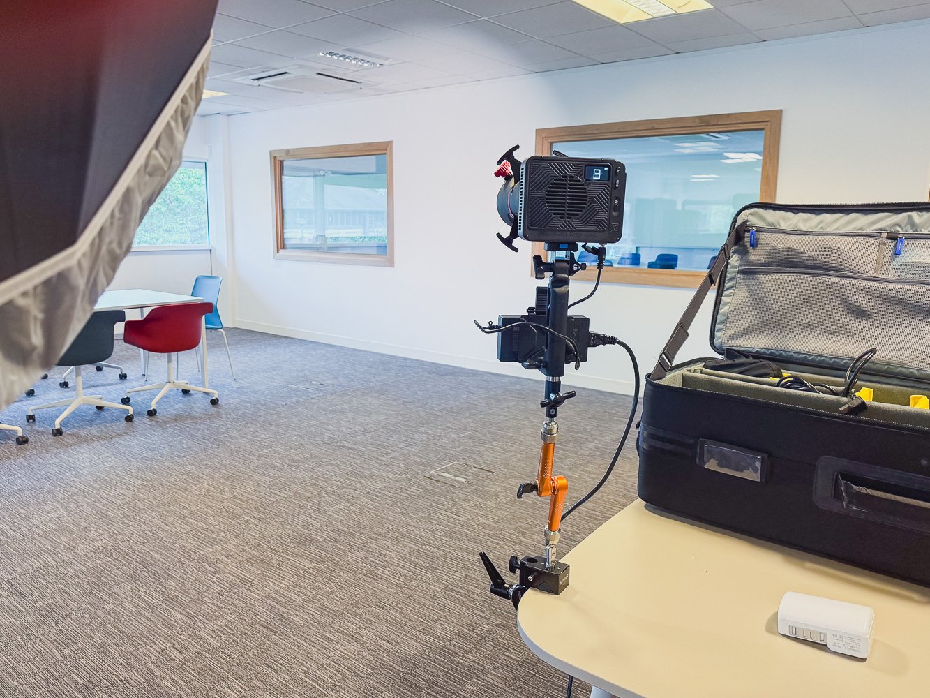 Bright Tangerine Titan Arm 2 Ti in use with Amaran Ray 120C