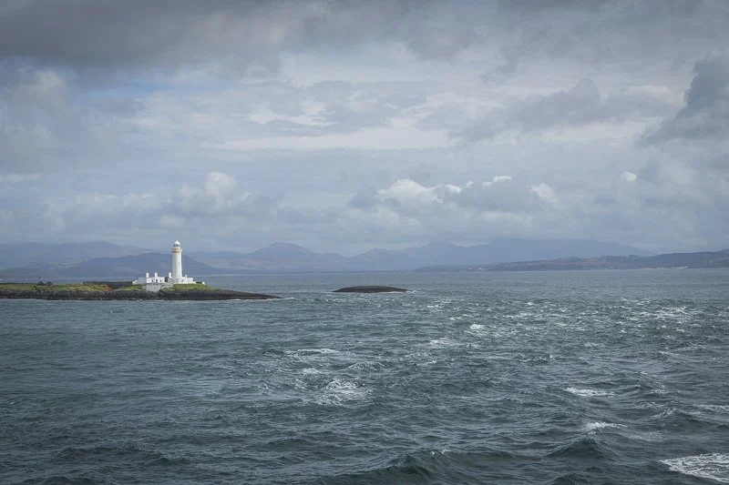 A lightouse and rough seas on the route to the Outer Hebrides