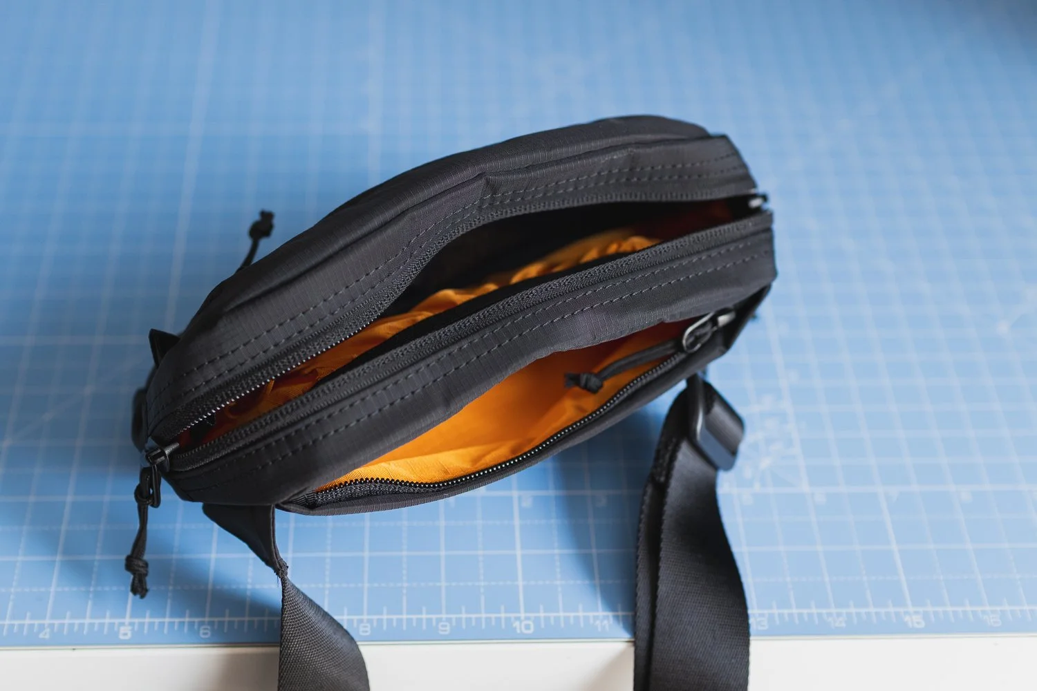 Tomtoc Aviator-T33 Sling top view showing Orange compartments