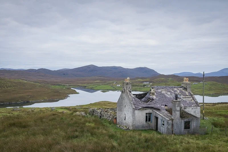 A derelict property on the Hebridean Way under grey skies