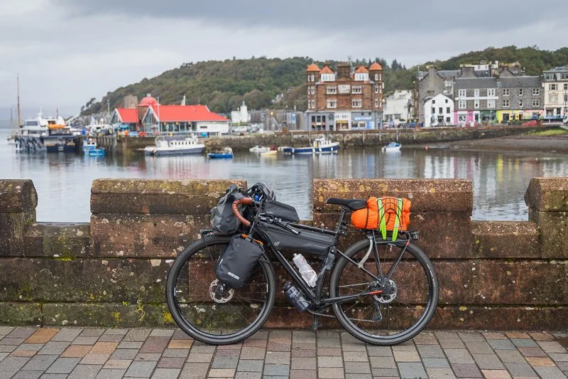 A bike leaning against a wall in Oban, Scotland