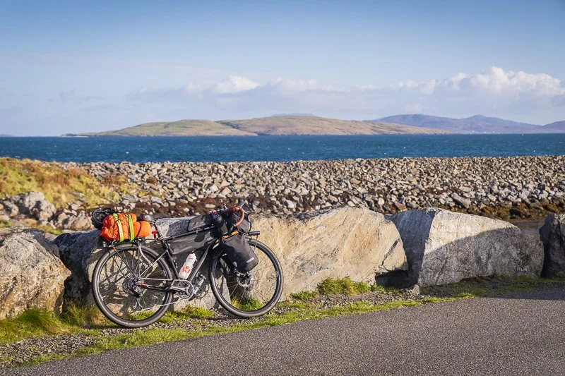 A Bikepackers bike leaning against a wall on the Hebridean Way in the Outer Hebrides