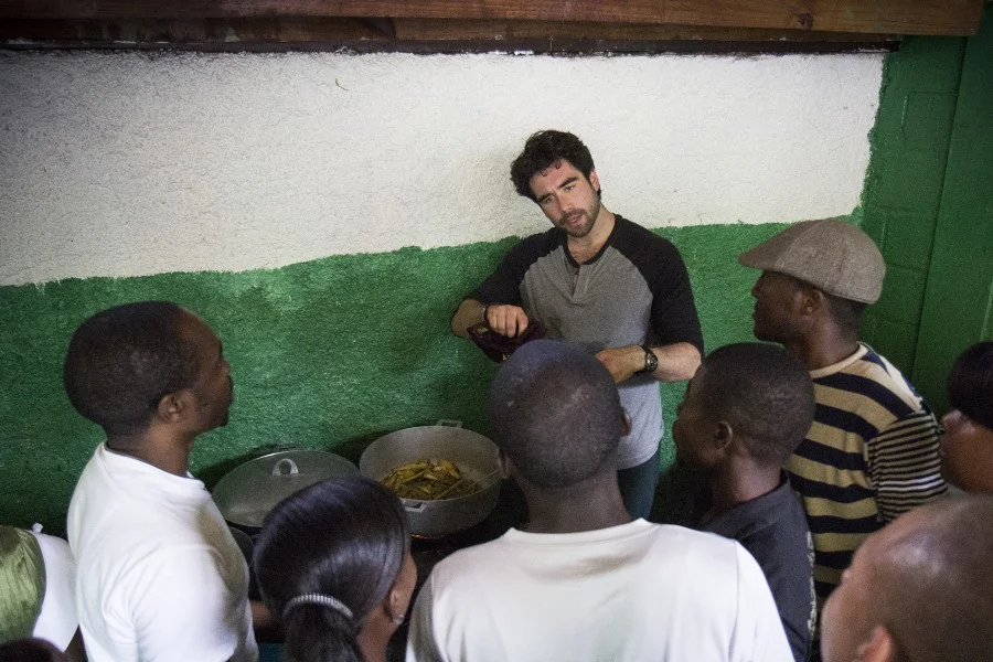 Demonstrating how to cook traditional Haitian curry; Photo by Crystal Wells