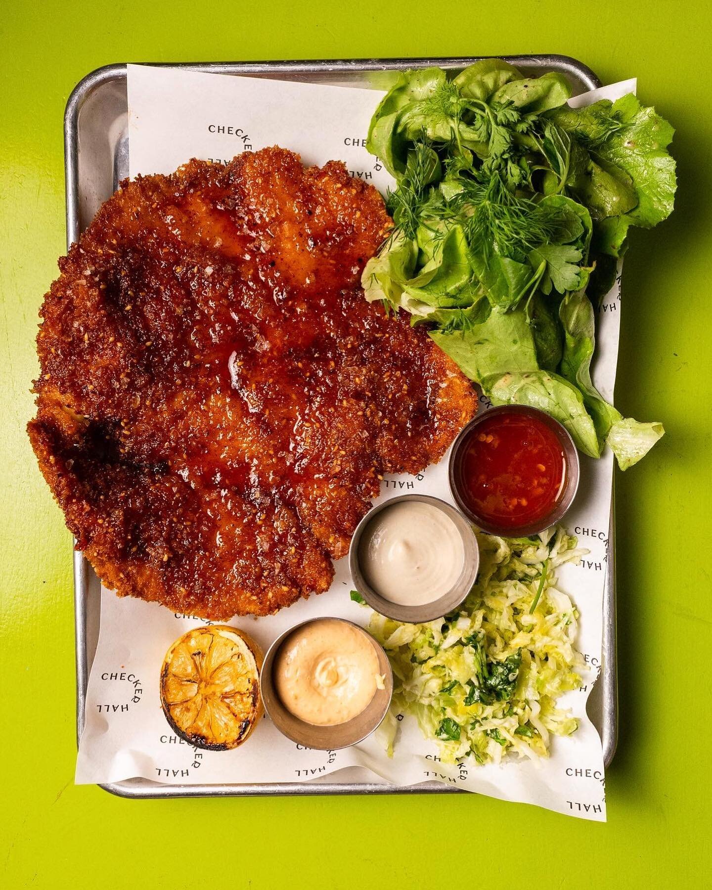 Schnitz&rsquo; &amp; Schvitz 💦

Crowd fave @checkerhall - chicken schnitzel brushed with spiced honey served with with trio of sauces, bib lettuce herb salad (best if used as wraps) and slaw.